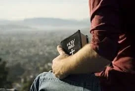Man with bible.jpg