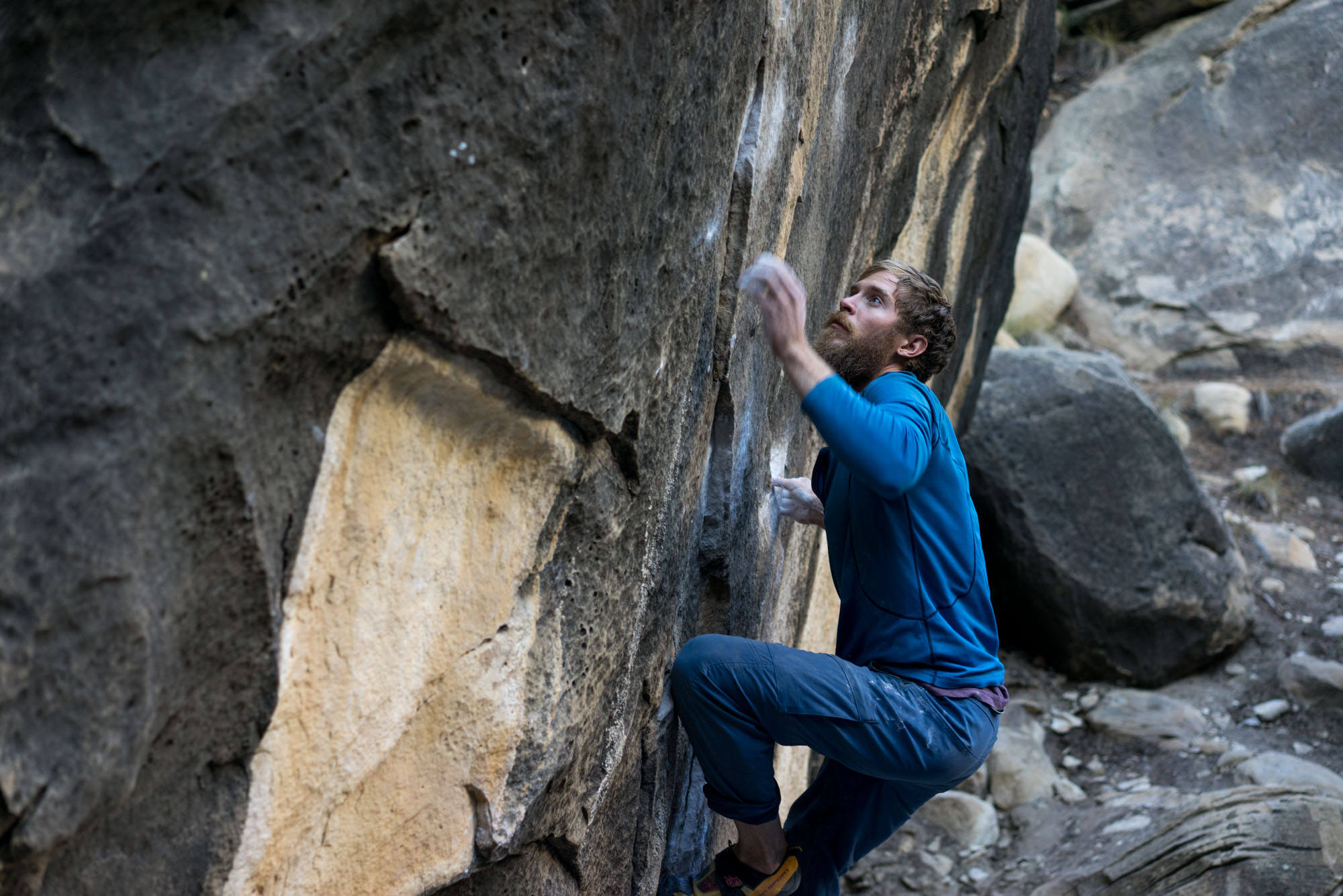 Thomas wrestling a boulder in Joe's Valley