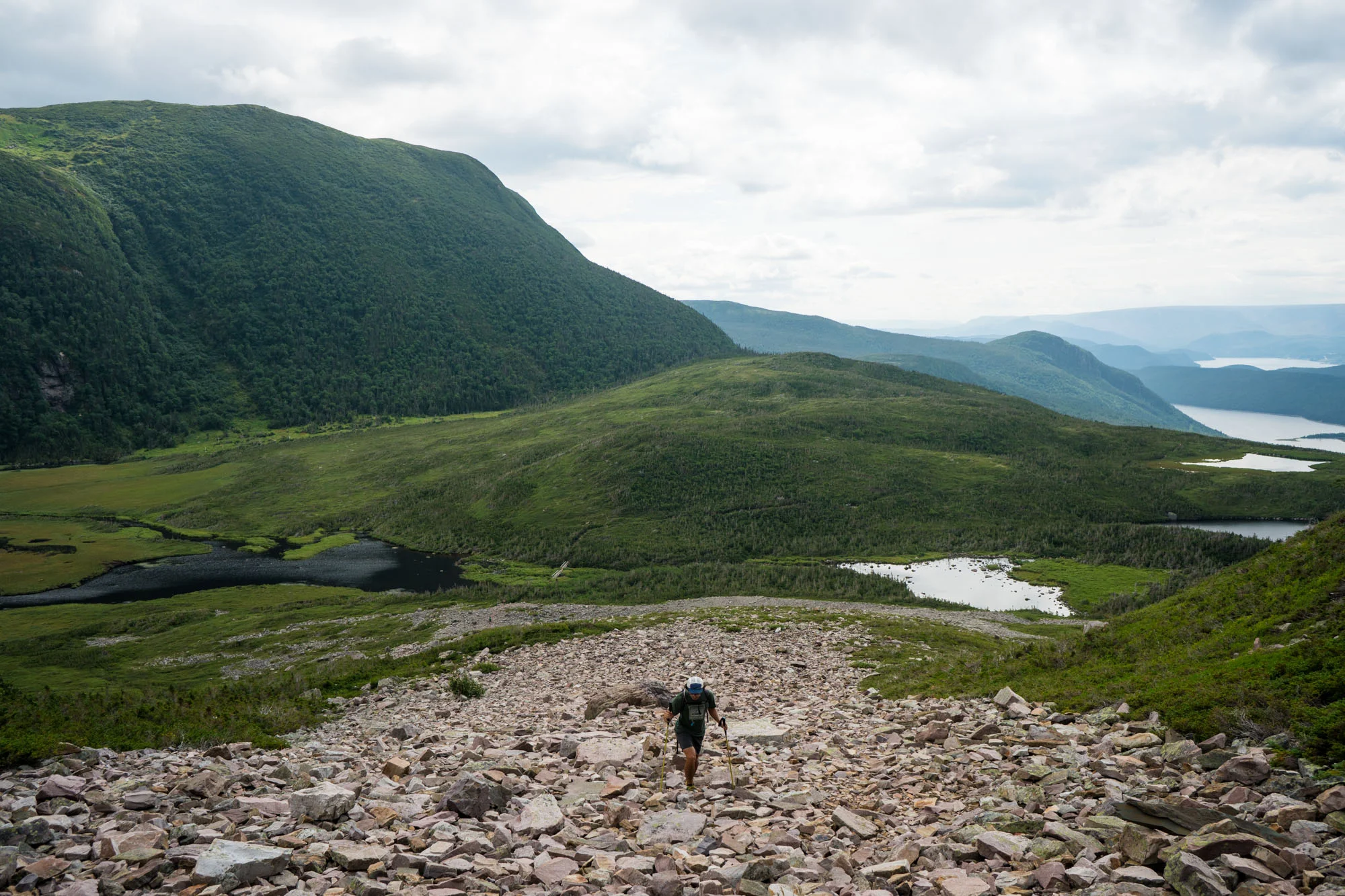 Owen starting the trail up to the summit of Gros Morne via the rocky mountain side
