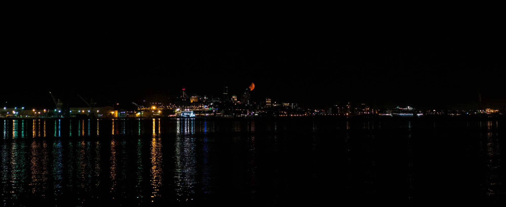 Our view from camp across the water from downtown Quebec City. The moon was so orange that night!