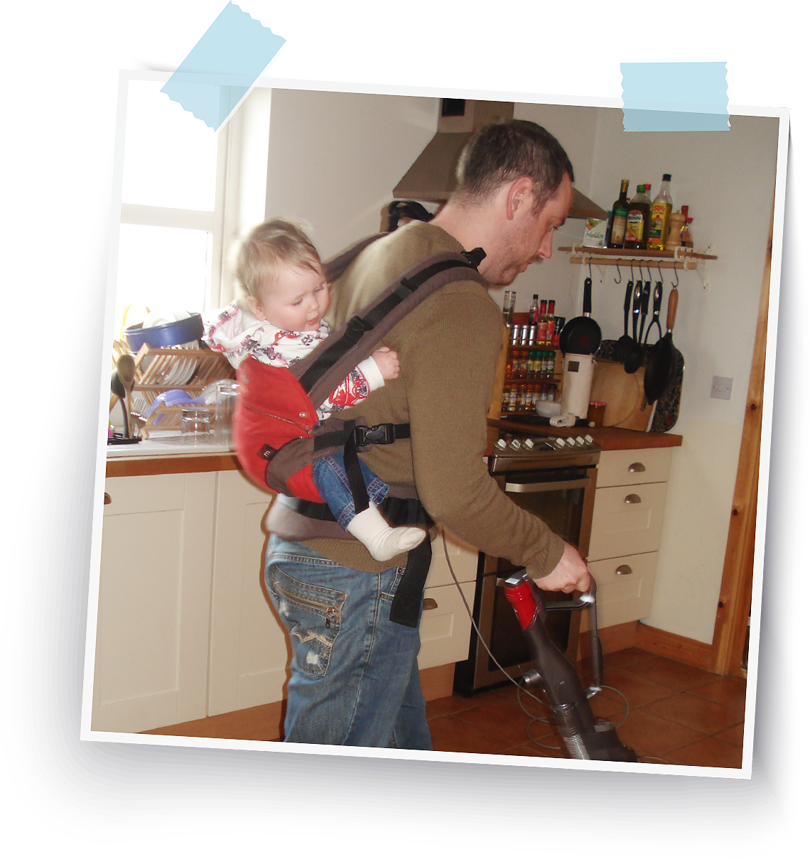 Daddy wearing a Manduca carrier.