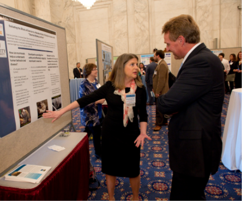 Kimberley Phillips (pictured here with Sen. Jeff Flake (R-AZ)) is Professor of Psychology and Co-Chair of Neuroscience at Trinity University, with additional appointments at the Southwest National Primate Research Center, Texas Biomedical Research Institute and the Research Imaging Institute, University of Texas Health Sciences Center at San Antonio. Dr. Phillips attended Wofford College (South Carolina) for her undergraduate degree and The University of Georgia for her graduate degrees. She has studied primate behavior in the field and laboratory for over 20 years. Dr. Phillips has lived and traveled all over the world but now calls San Antonio home. (Photo credit: Charles Votaw) 