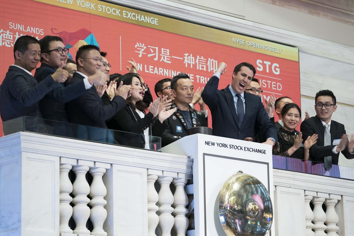 Opening bell ringing during Sunlands IPO at the NYSE