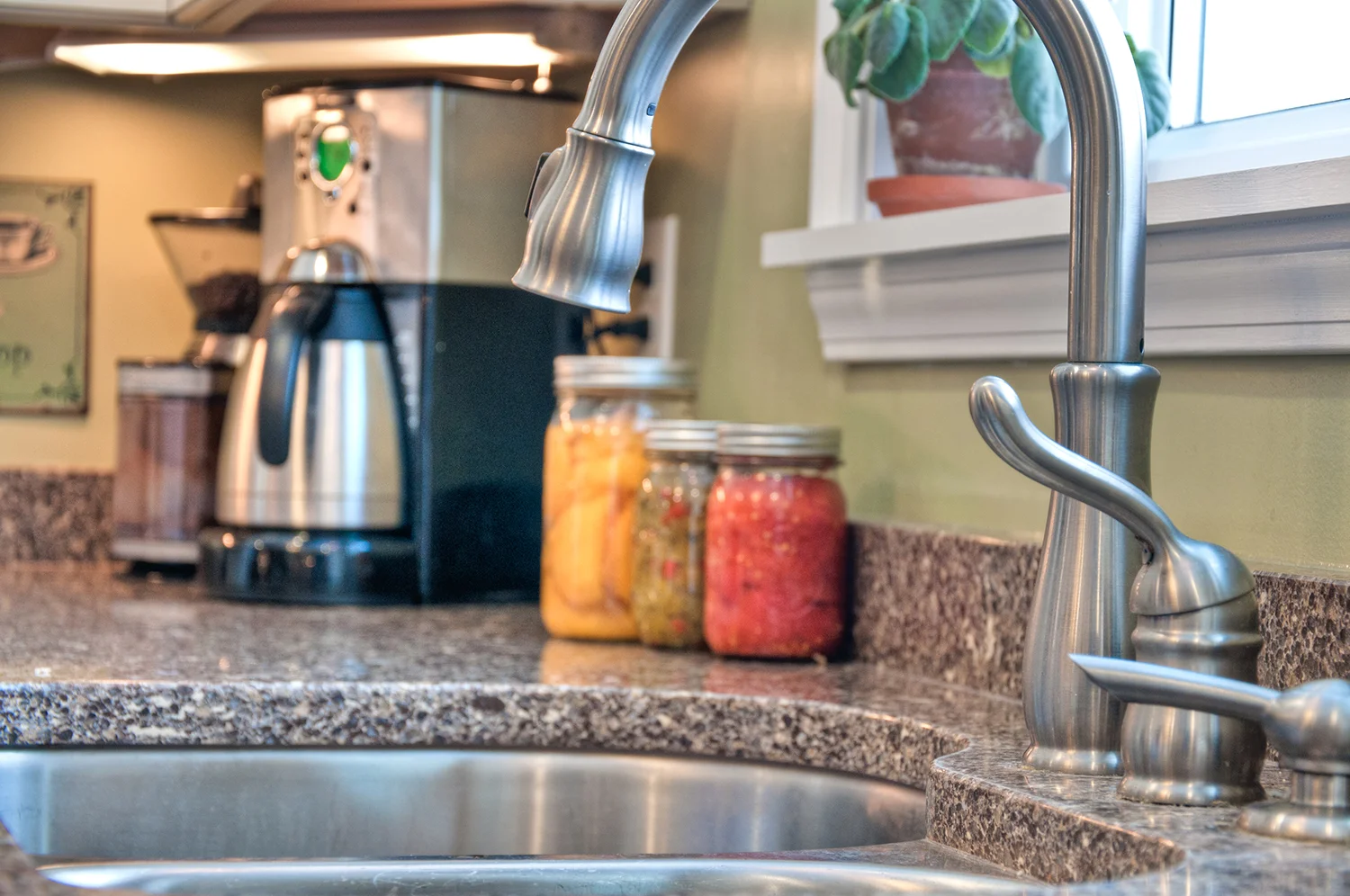 Counter details: Cambria Quartz in Halstead with a stainless steel pull-down Delta faucet