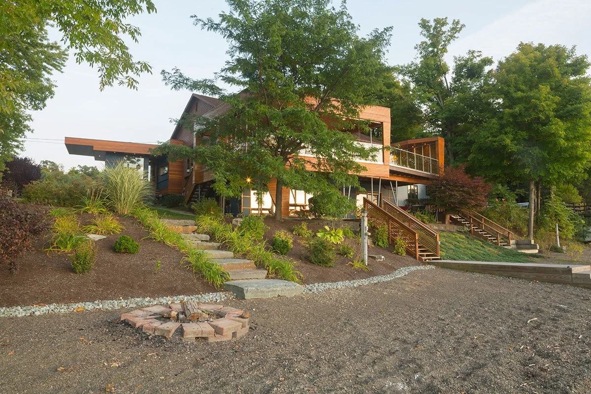 lake-house-deck-idea-modern-shore-stairs-stone-wood.jpg