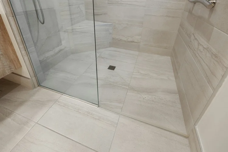 Level-entry tiled walk-in shower with glass screen