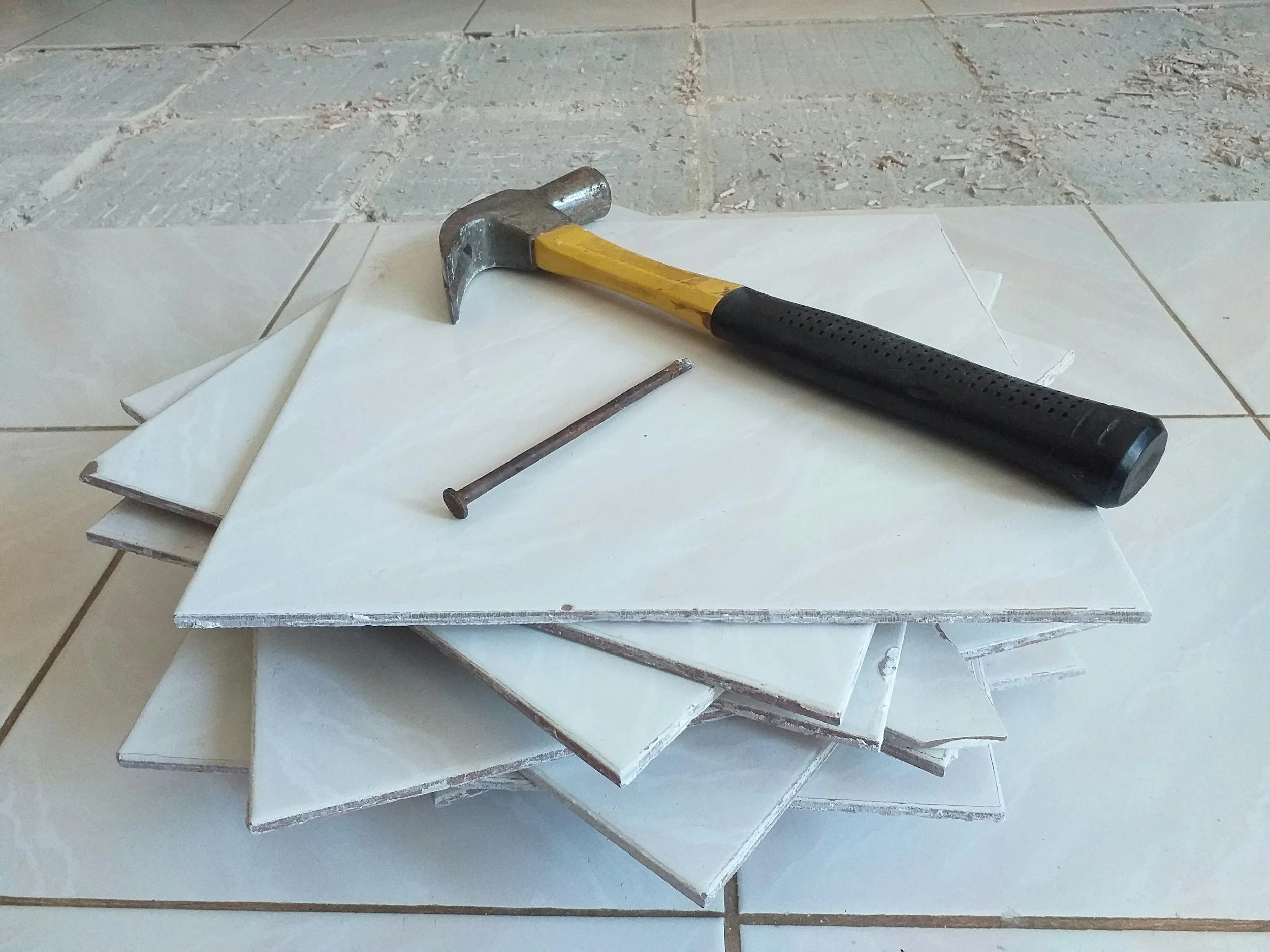 Broken tiles removed for emergency tile repair