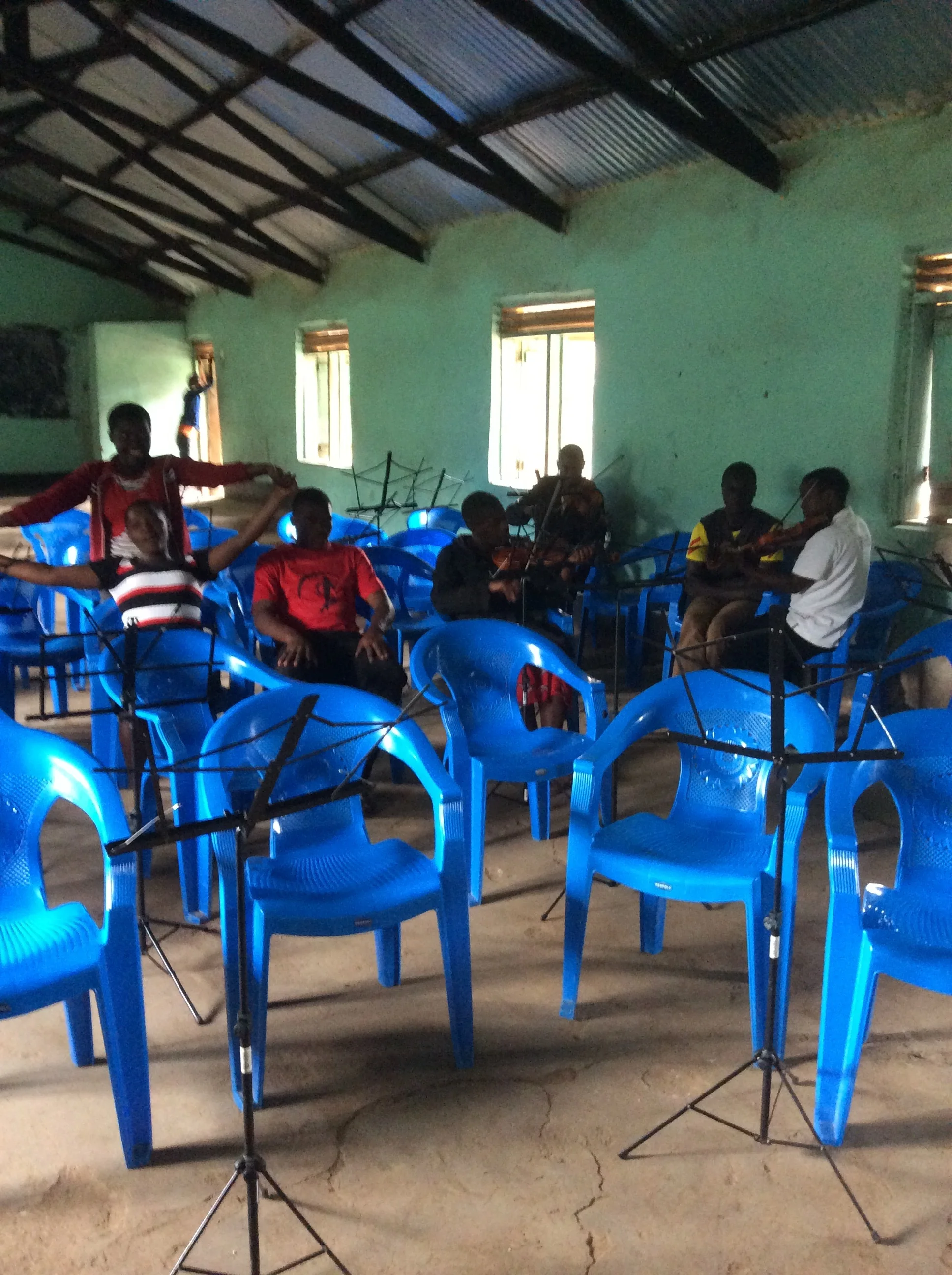 At the beginning of rehearsal, the room was the normal dimness...