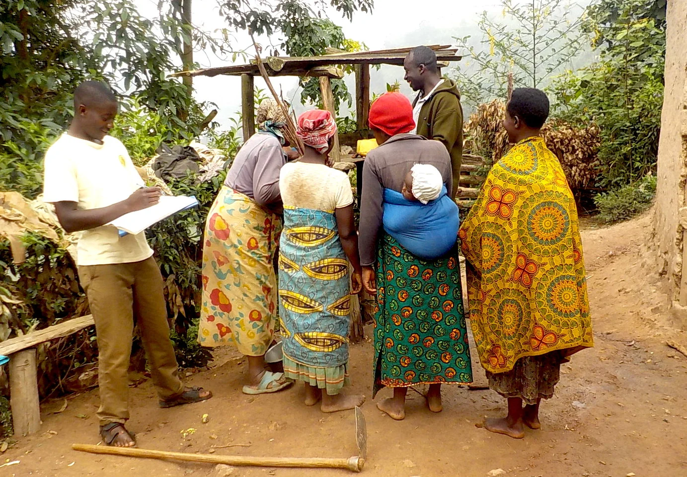 ACT Health Promotion Worker explaining the value of the use of a drying rack for sanitation.