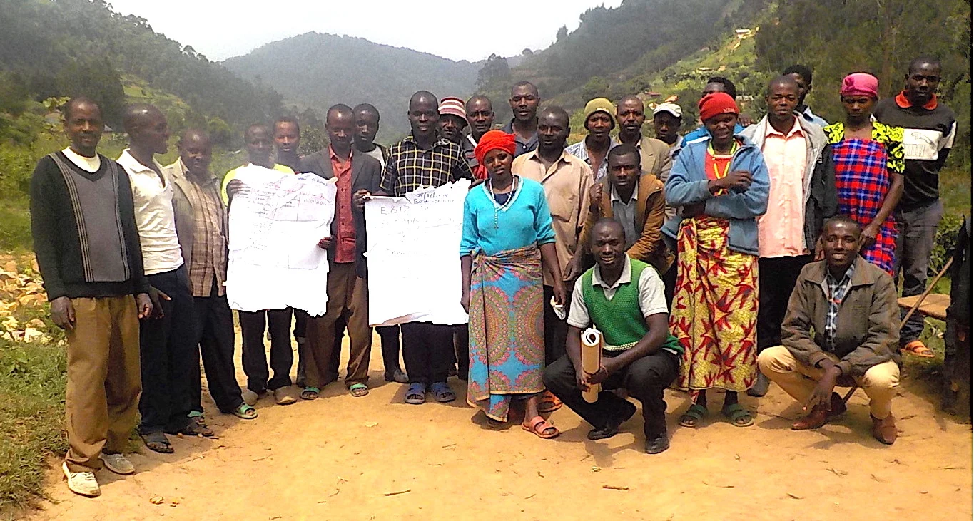 Village members having just completed a dialogue with their Action Plan on flipcharts.