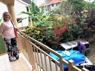 Sharalyn looks while Christopher loads the van below.jpeg