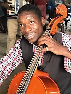 A proud cellist having so much fun making music!