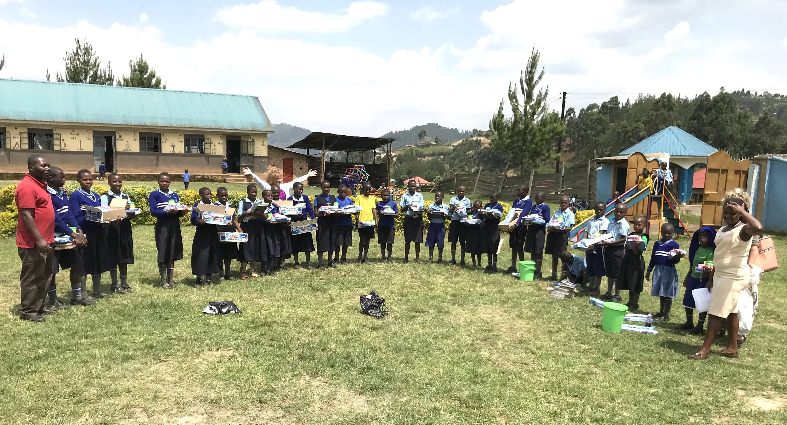 Karen and Judith (to the right) with our kids enrolled at Uganda Martyr’s Primary School.