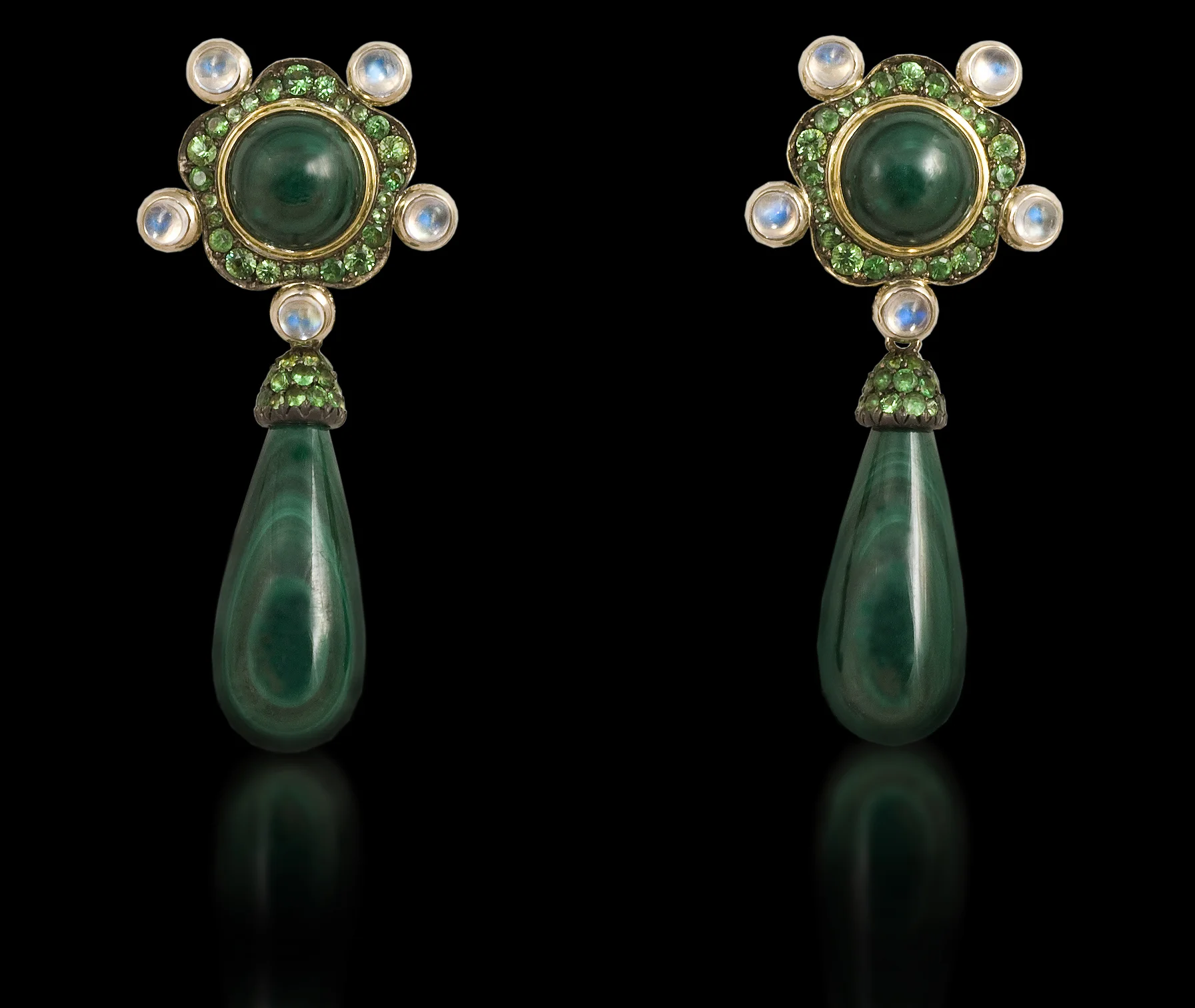 Ethiopian Queen In the darkness of the green forest jewels of water and gems sparkle in the night. Earrings in 18 karat White Gold, with Malachite, Moonstone, and Green Garnet $4.500