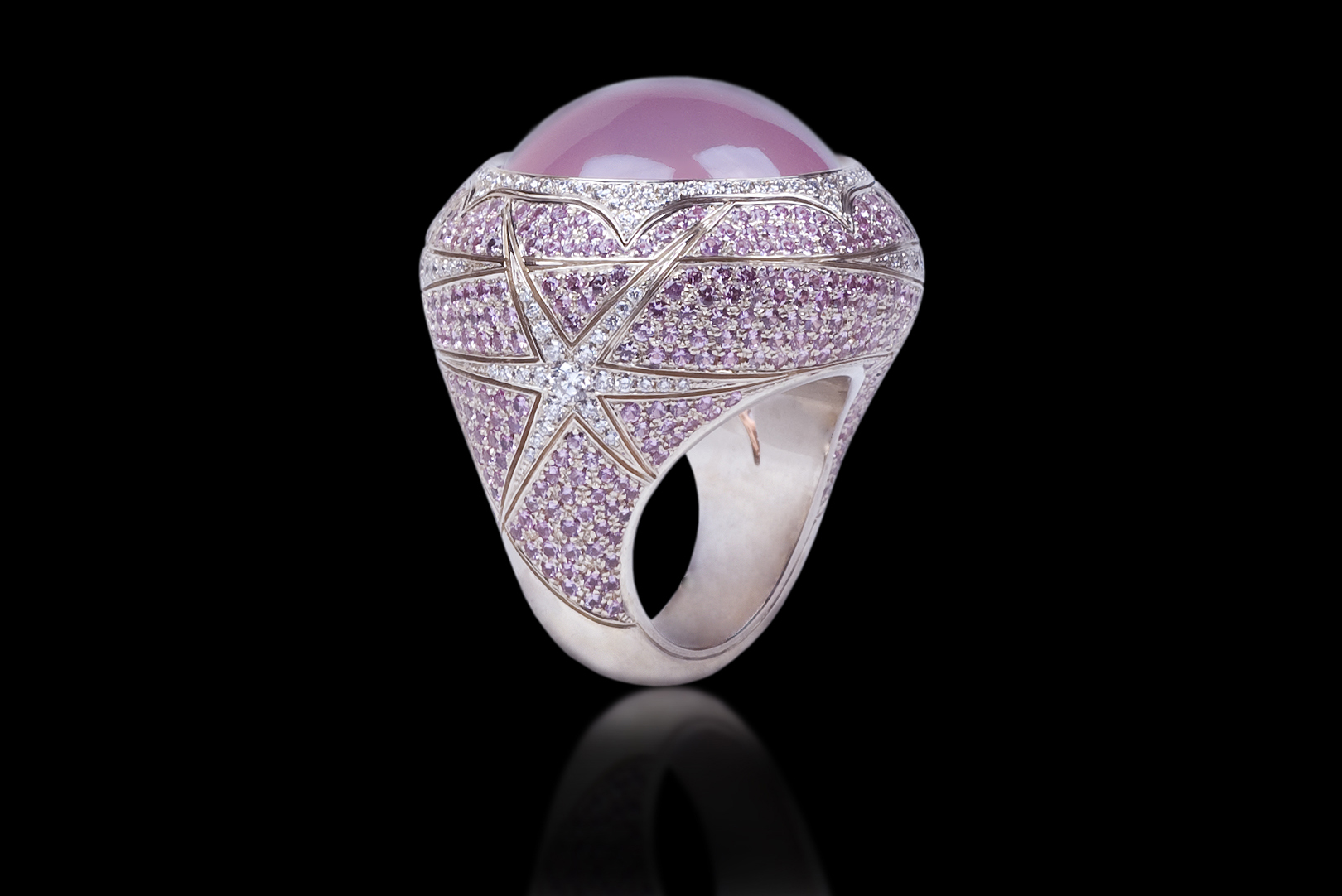 Ring - Starry Day The jeweled designer ring transforms us into a princess. Ring in 18 karat White Gold, with Rare Star Rose Quartz, white Diamonds and Pink Sapphire Please call for price