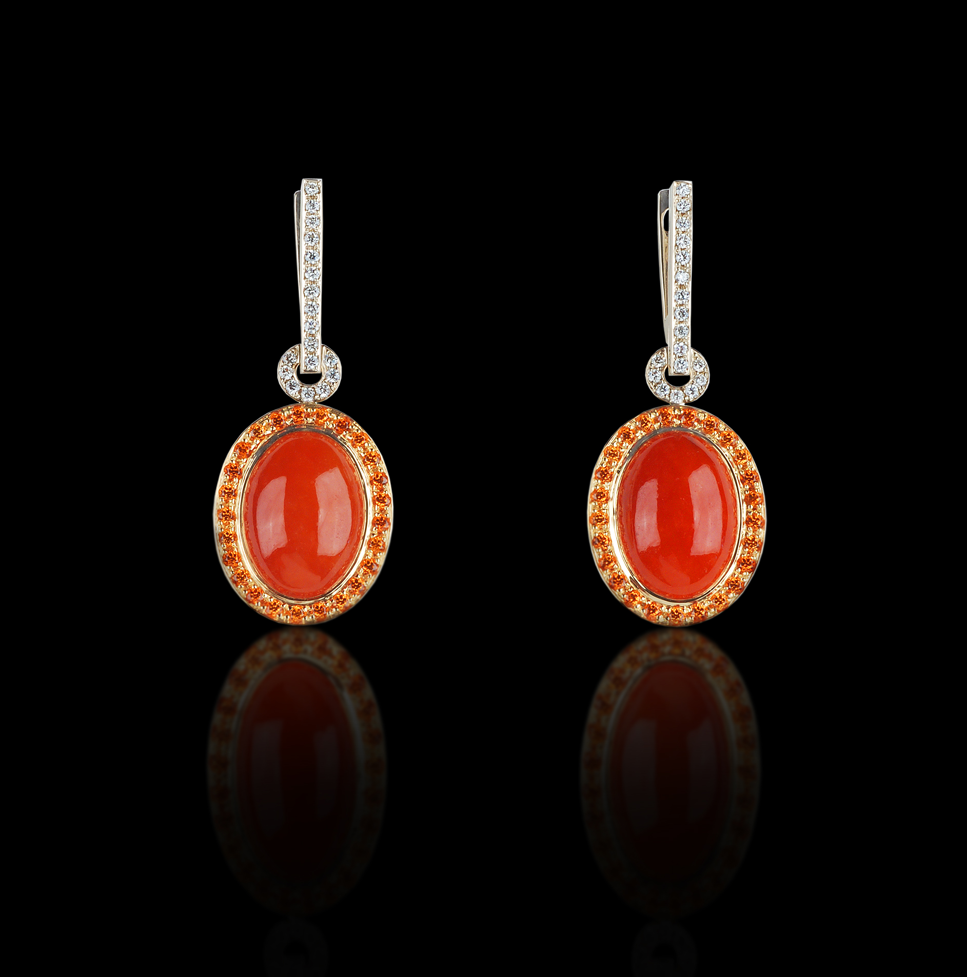 Red Splendor Passion is best harnessed and displayed for all to enjoy. Earrings in 18 karat Yellow and White Gold, with Spessartite garnets, Red Jade, and White Diamonds $9,000