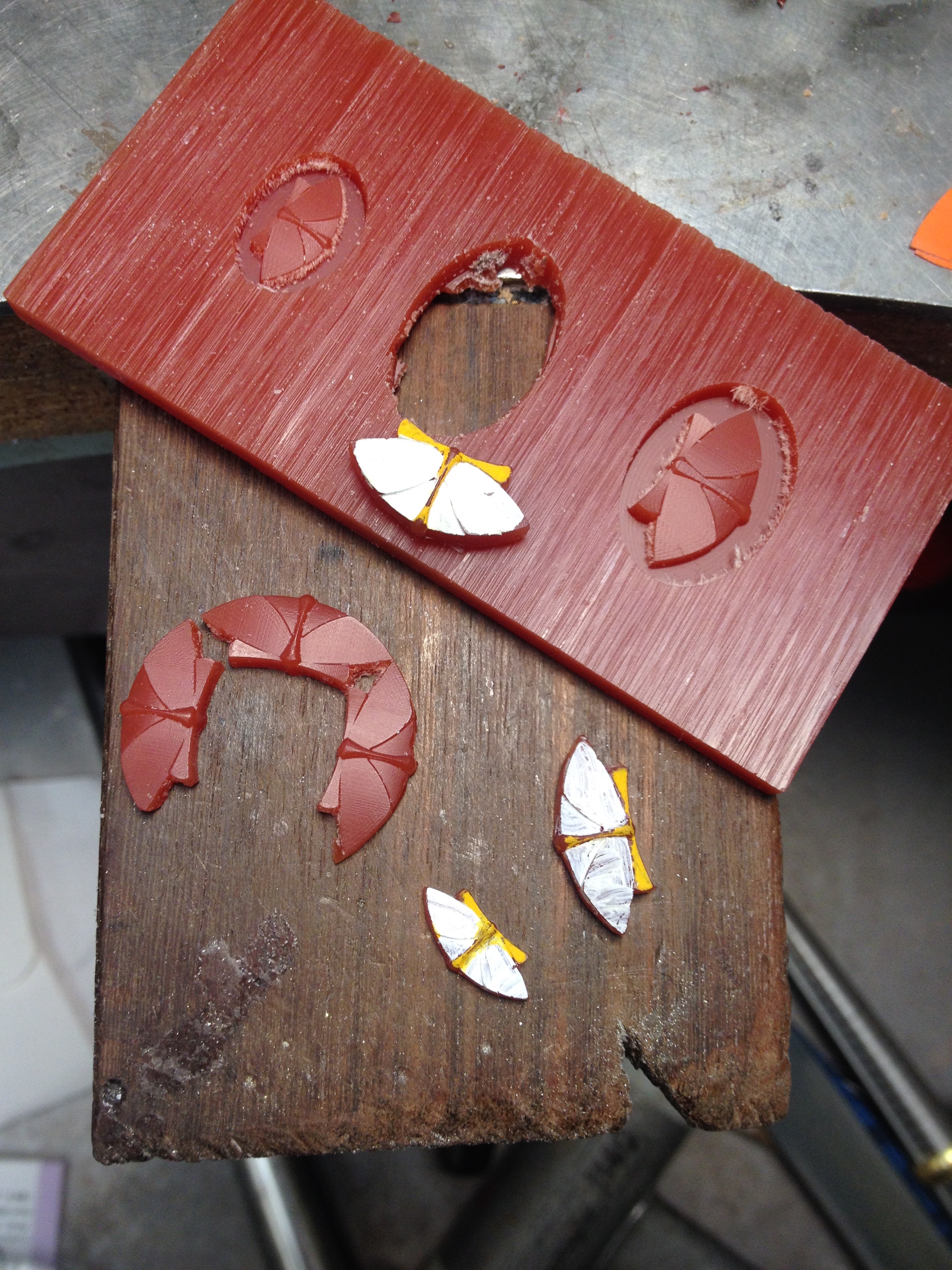 Here are three different sizes and shapes of the cut wax painted with goache to show the effect in 18 k yellow gold and mother of pearl. Gregore and Jennifer-rabe Jewelers in Santa Barbara, CA