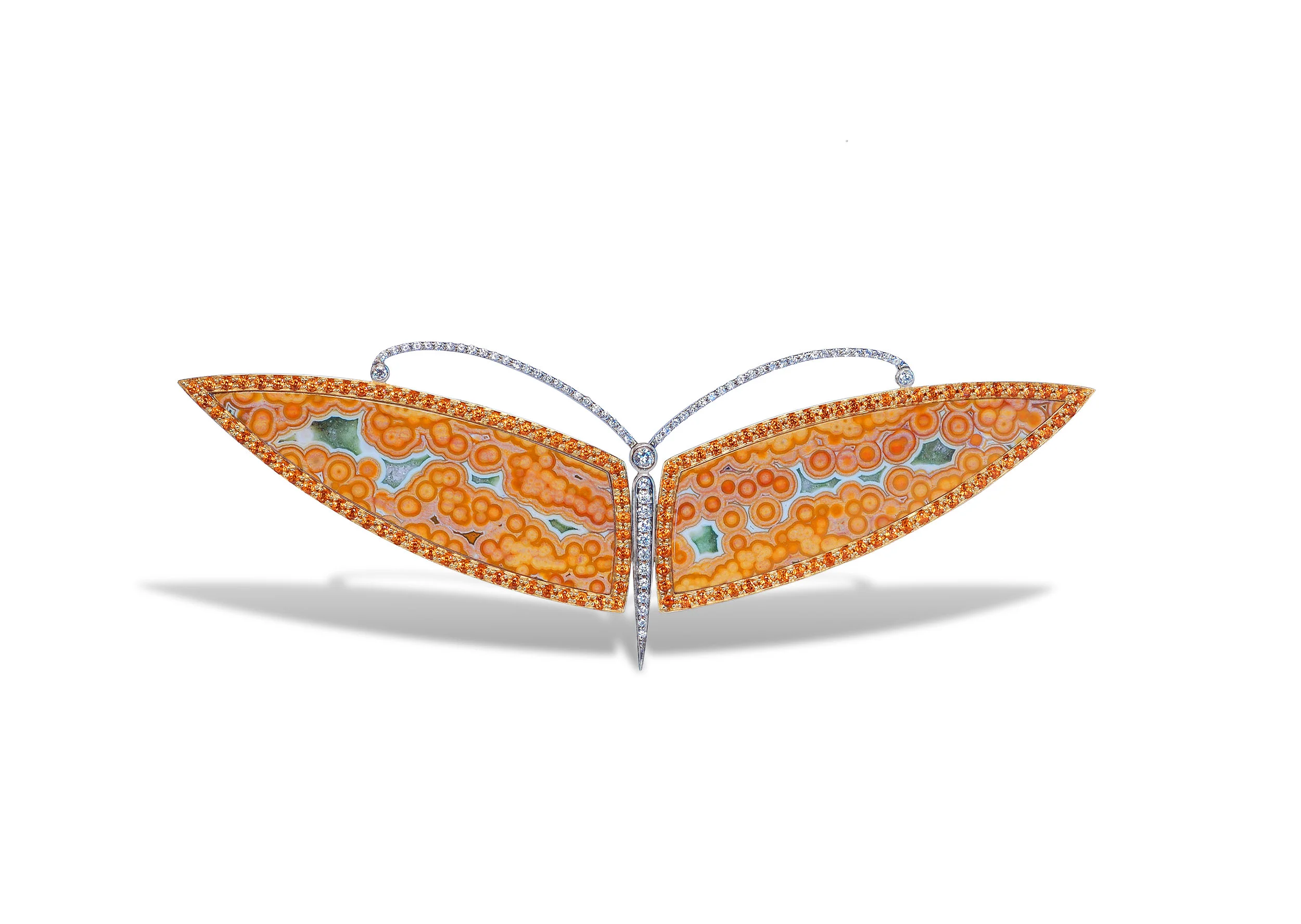 brooch in 18 karat white gold, ocean jasper wings, and white diamonds in the antenna and body
