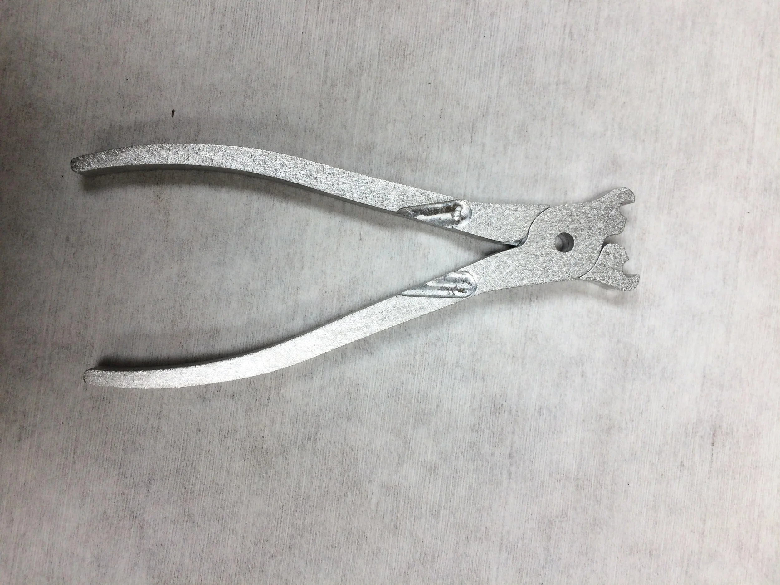 The plier handles together