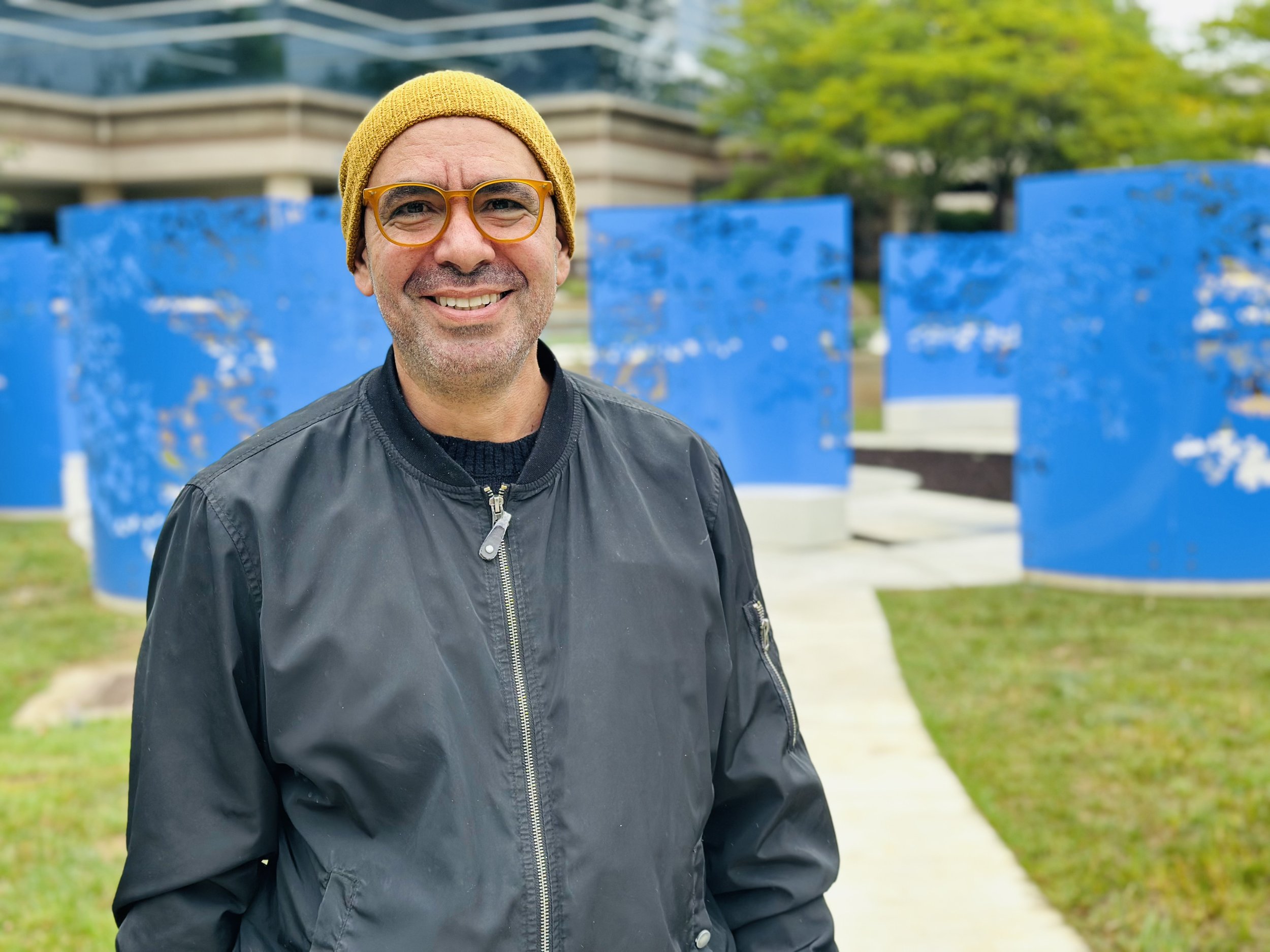  The panels are rolled aluminum, waterjet-cut and powder-coated blue to connect  one’s gaze to the sky. Their patterns evoke groves of flowering dogwood—Virginia’s official tree and  flower—casting shadows across the space, a marker of the passage of