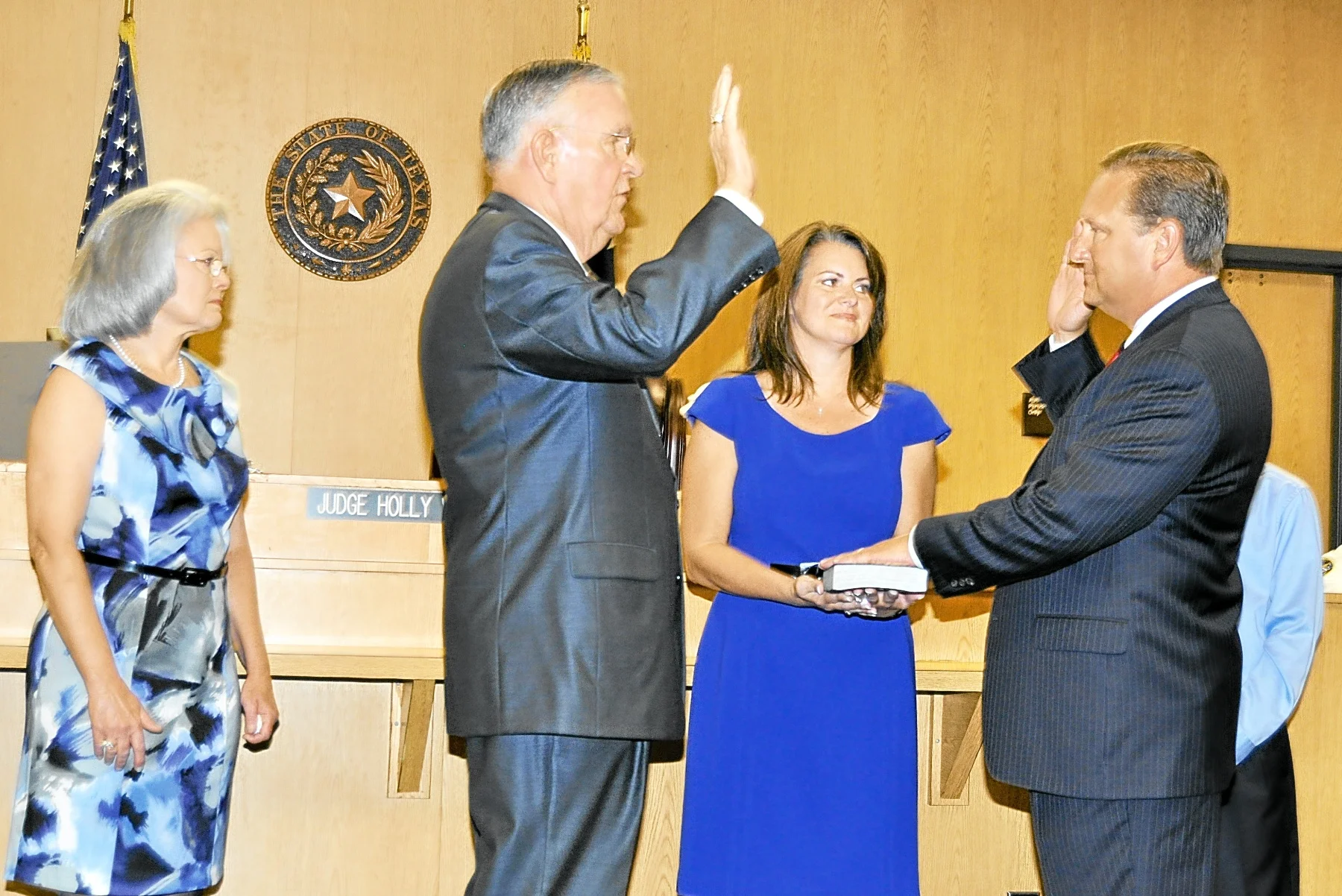 Constable Sandlin, Joined by his wife nerissa and their son blake, is sworn in to office in 2011 by former constable Bill bailey.