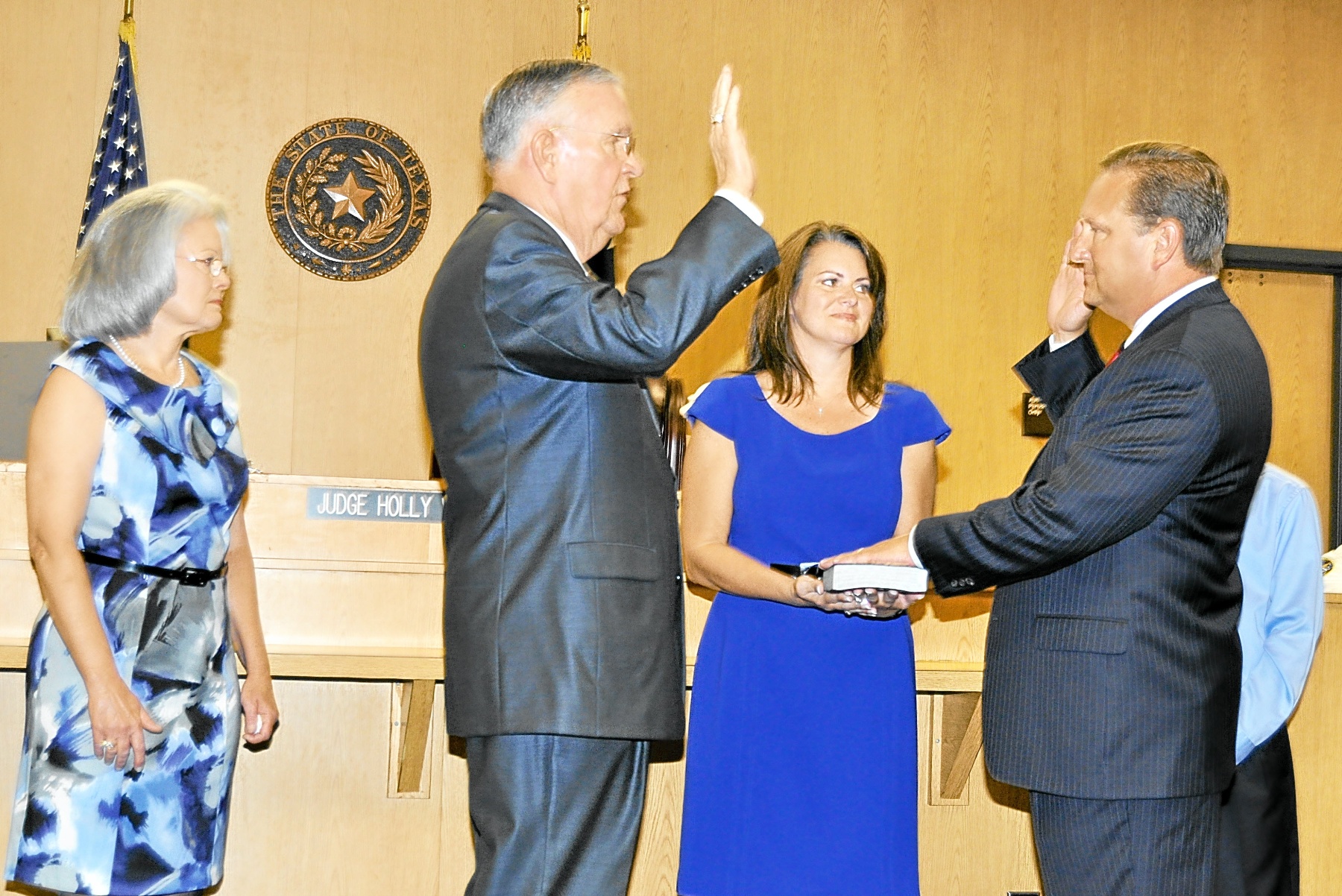 Constable Sandlin, Joined by his wife nerissa and their son blake, is sworn in to office in 2011 by former constable Bill bailey.