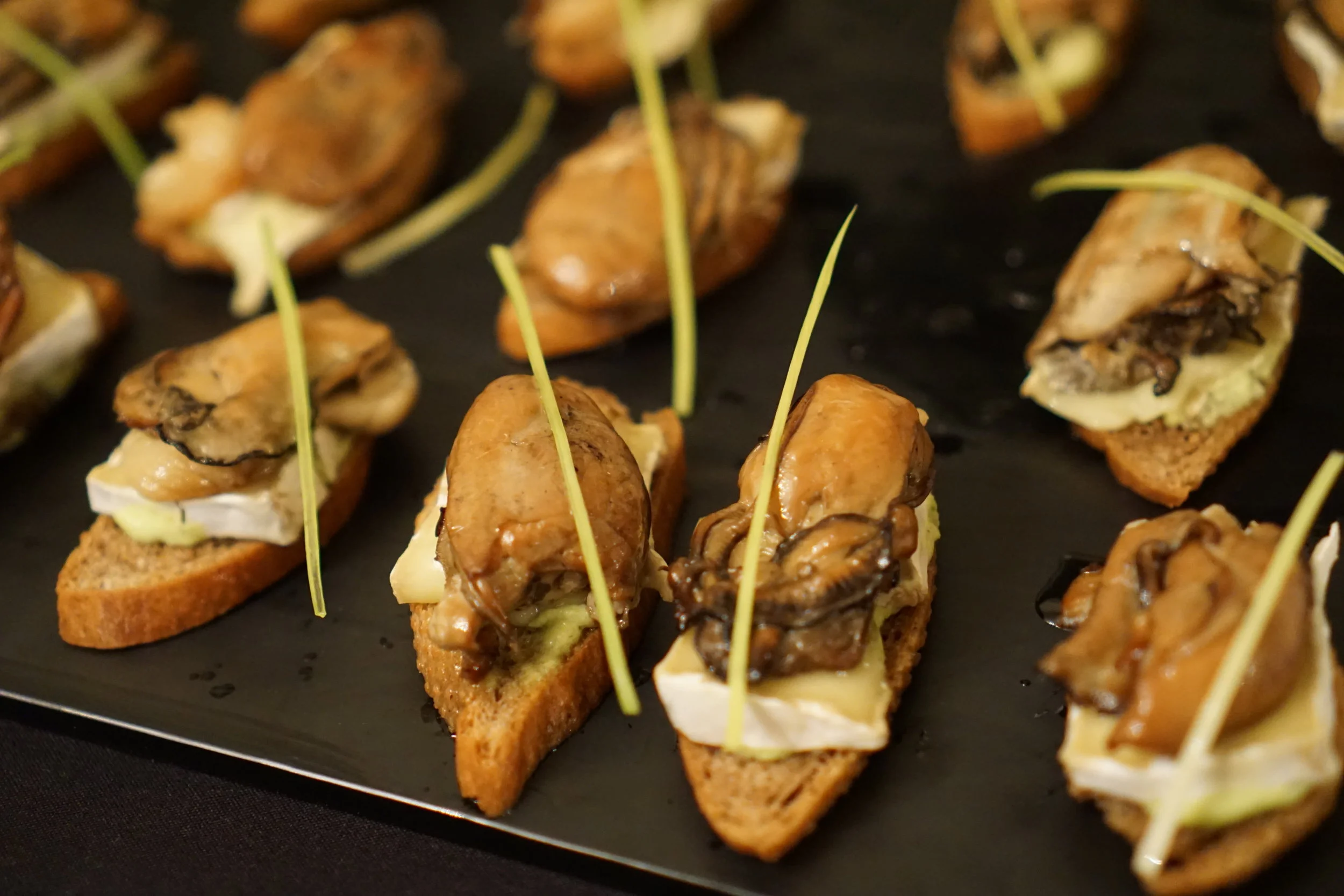 Smoked oyster and brie crostini made with Sonoran Gold Wheat (Chris Lozier photo)