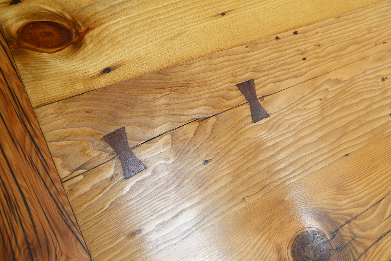  I fabricated and installed these black walnut butterfly keys, also known as Dutchmen, to secure a crack in one of the boards and keep it from growing.&nbsp; 