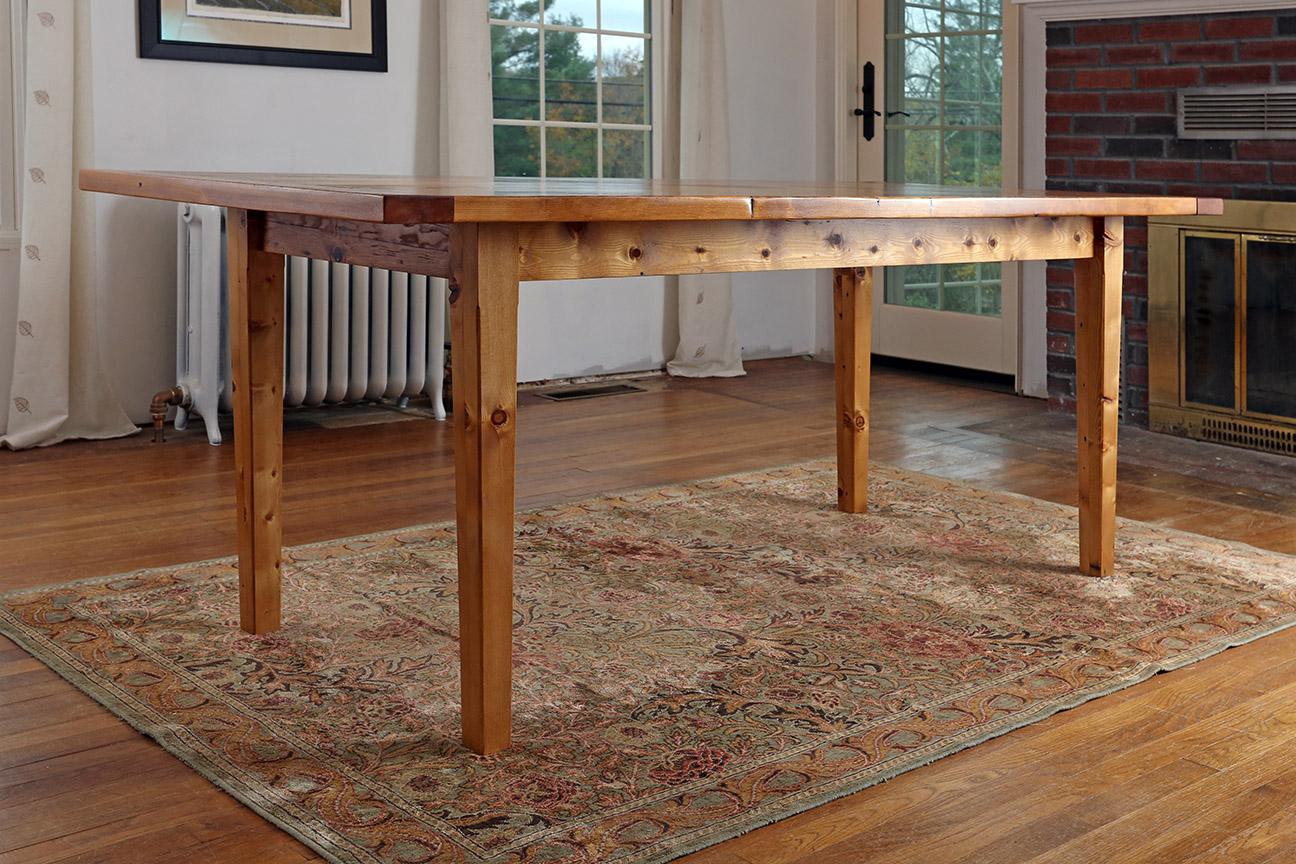  After removing many, many nails and cleaning up the original boards, I turned them into this farmhouse table. 