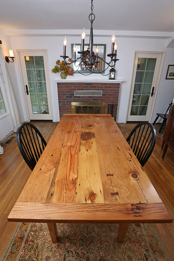 The breadboard ends on the table help to keep the tabletop flat while still allowing it to expand and contract with seasonal changes. 