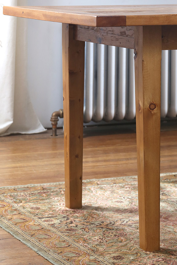 A slight taper to the legs gives them a little visual interest and reduces the visual weight of the legs so they don't overwhelm the overall design. 