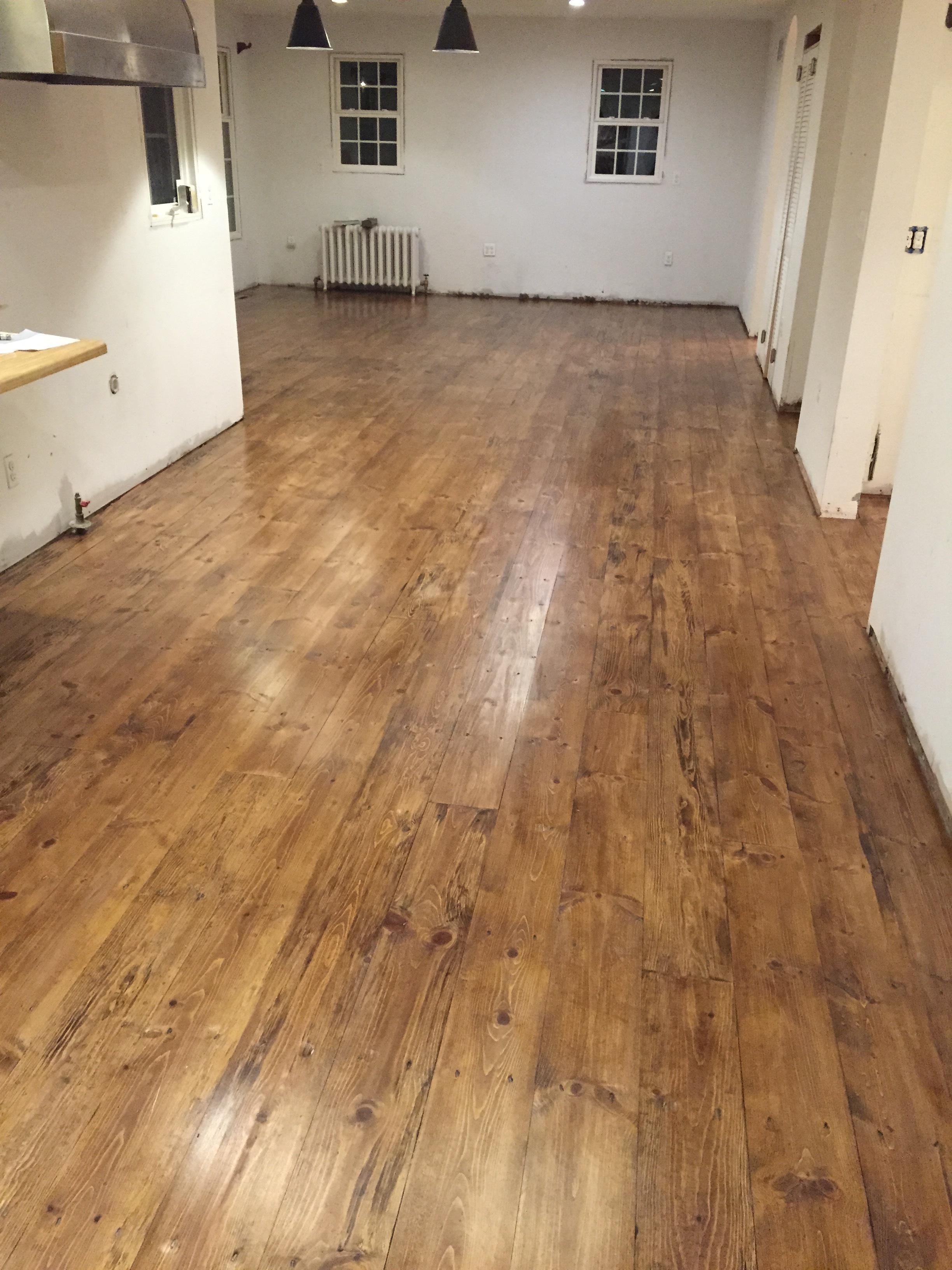  After staining and a few coats of polyurethane, the floors were finished.&nbsp; 