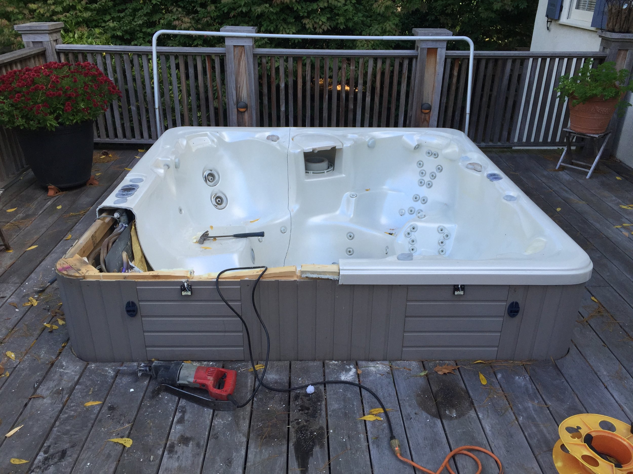  The clients I had built  this  ipe deck for a few years back, called up and told me their hot tub had finally died. They decided that instead of getting a new one, they wanted the space converted into a raised planter bed. Here is the hot tub shortl