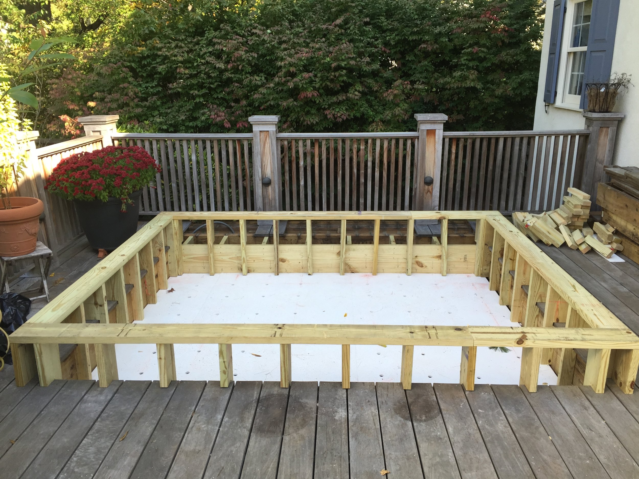  After removing the old hot tub and putting in some drainage lines, I framed up a new floor and side walls. I put down PVC sheets to line the bottom and then drilled holes through it to allow for water to flow through to the drainage lines.&nbsp; 