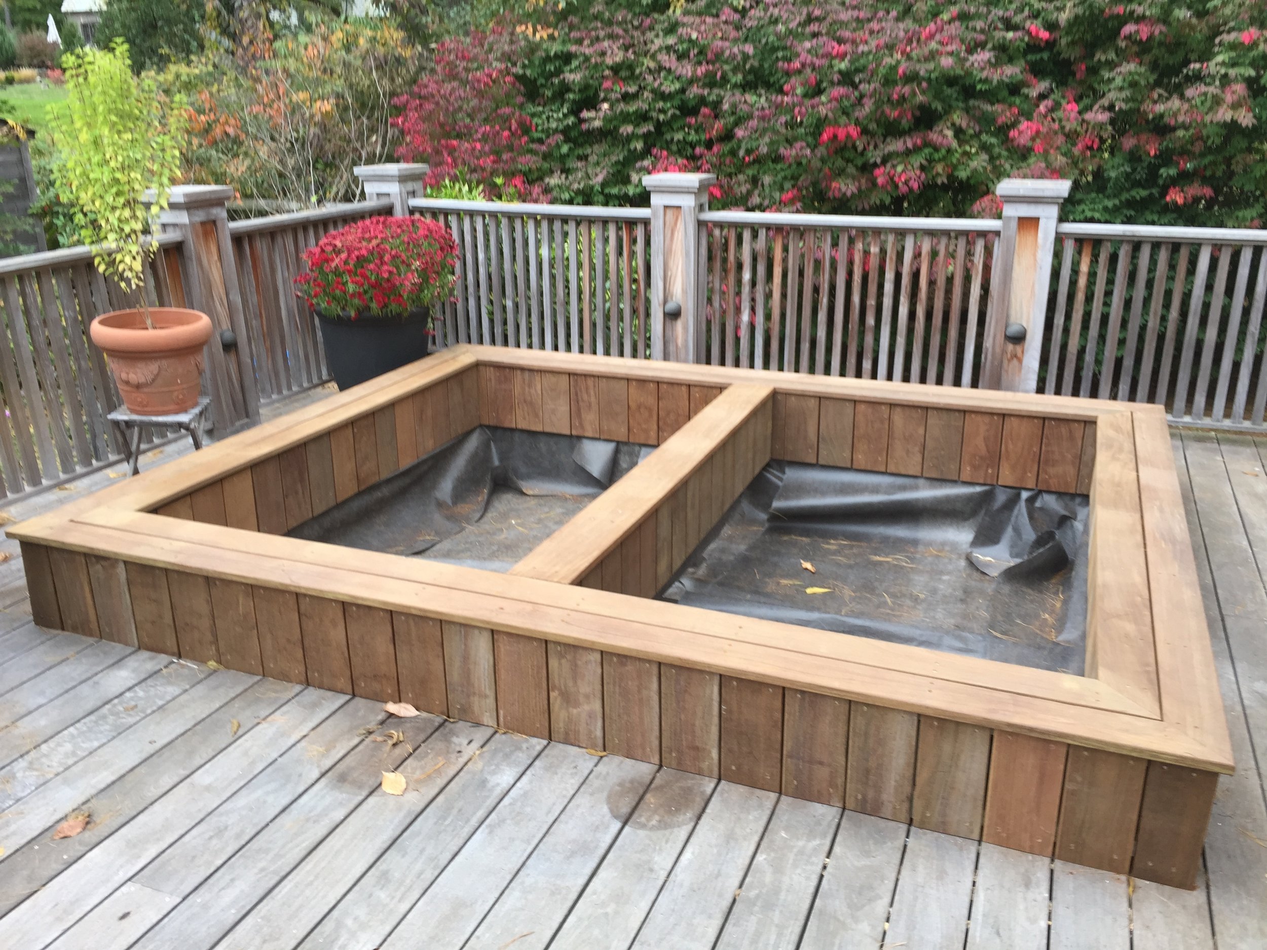  The last step for me was adding ipe deck boards across the top of the walls. After that, the landscapers brought in topsoil. 