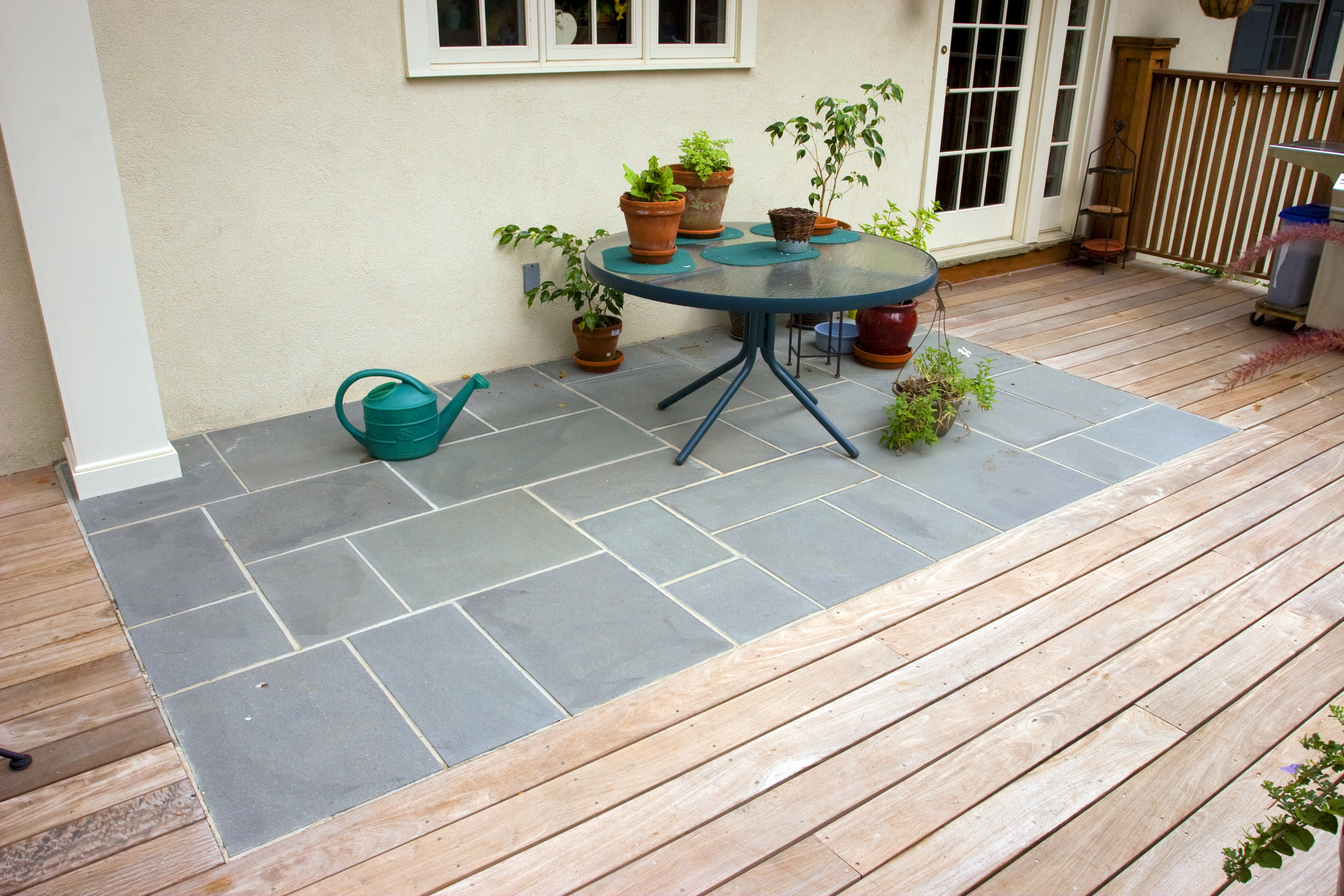  In the original deck there was a flagstone patio that the client wanted to keep, so we stripped the original flagstone off and reset new stones.&nbsp; 