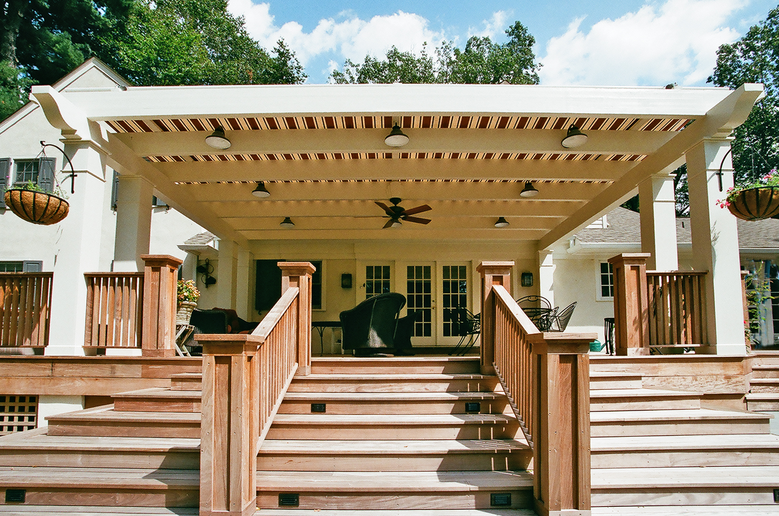  The pergola has a retractable canopy on it to provide shade from the summer sun. 