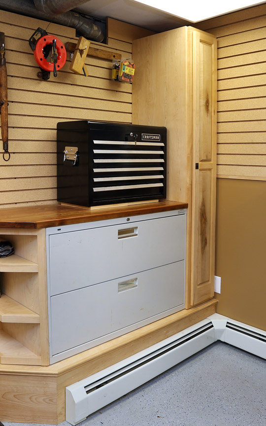  I built this tall cabinet and corner shelf unit along with the countertop to create usable space around the existing file cabinet. 