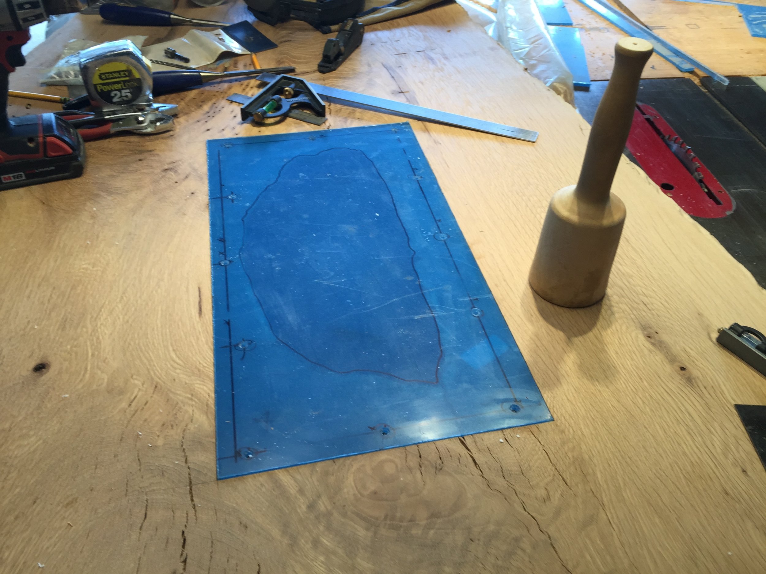  I inlaid a piece of plexiglass in the bottom of the slab under the central hole in order to fill it in. 