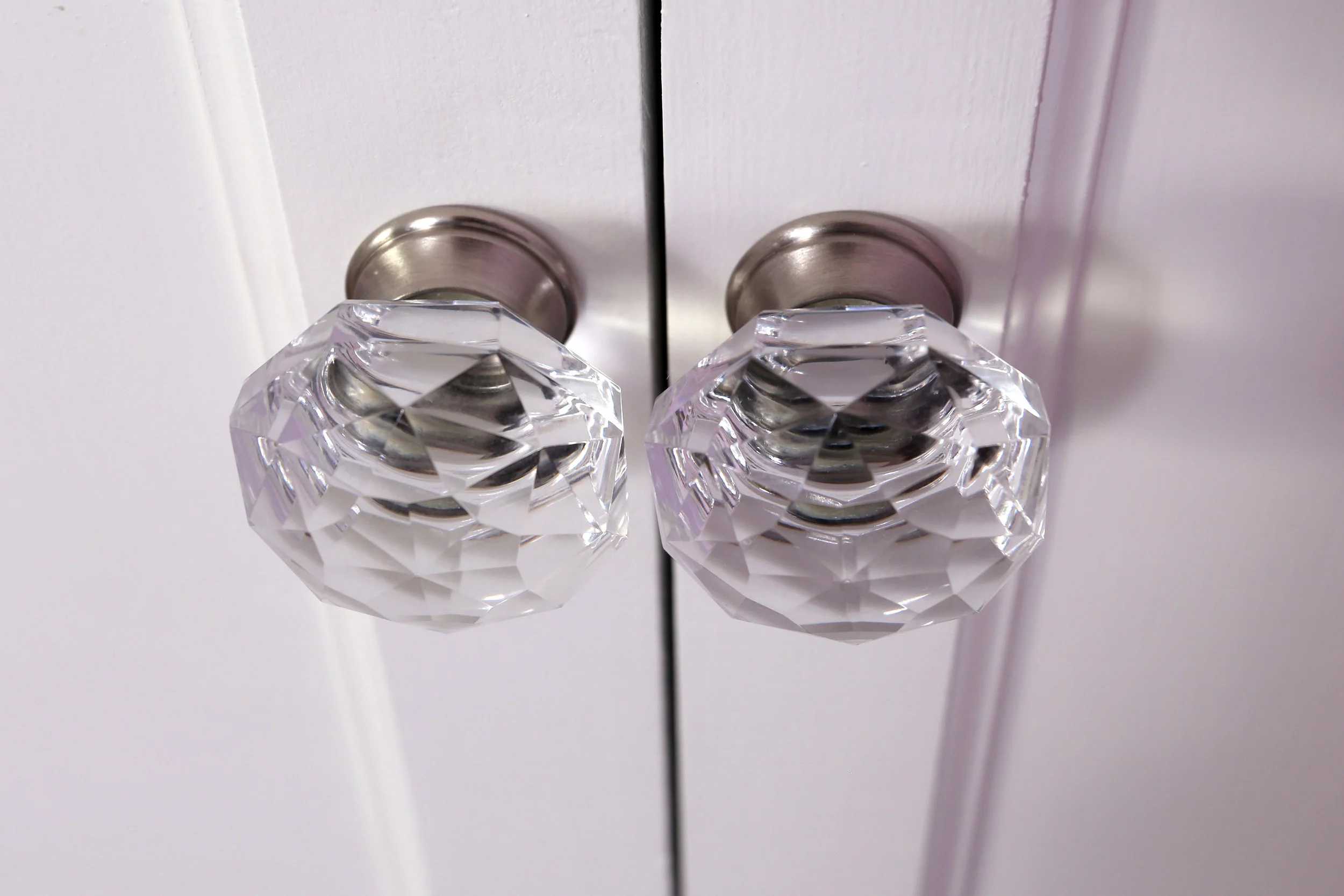  The client opted for these crystal knobs with a satin nickel base for their hardware. 