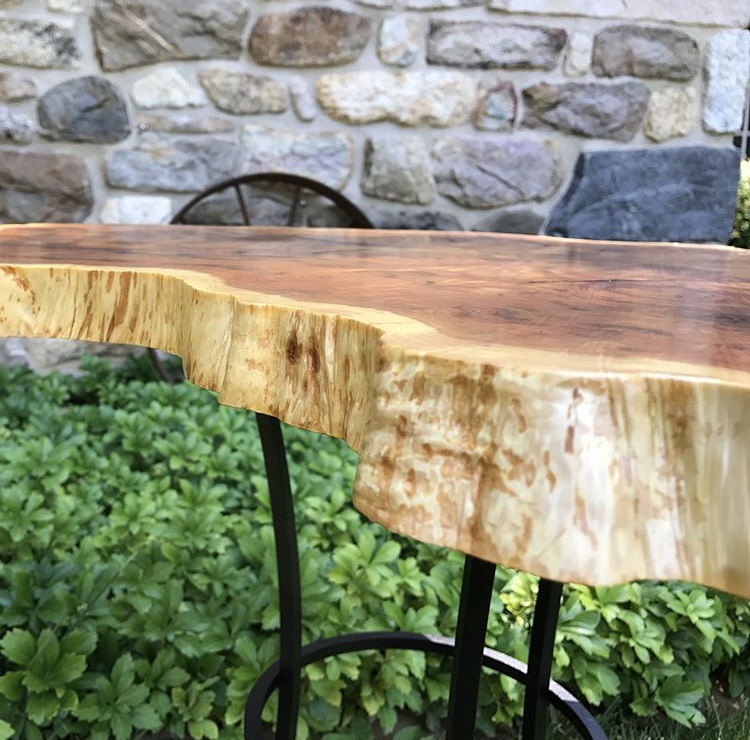  Looking down the live edge. The creamy white of the sapwood contrasts beautifully with the red heartwood of this yew slab.&nbsp; 