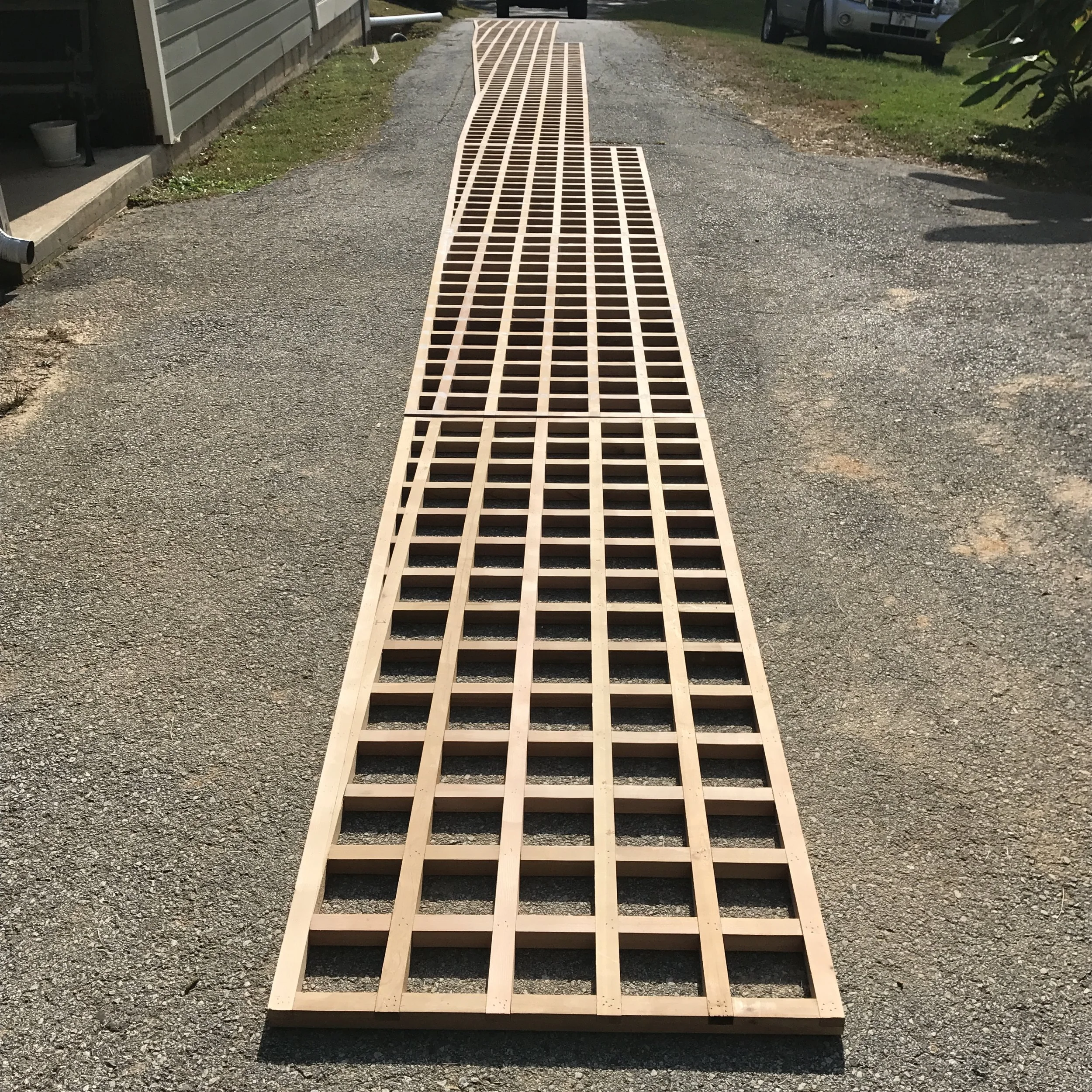  All the panels laid out end to end on my driveway to check their alignment. 