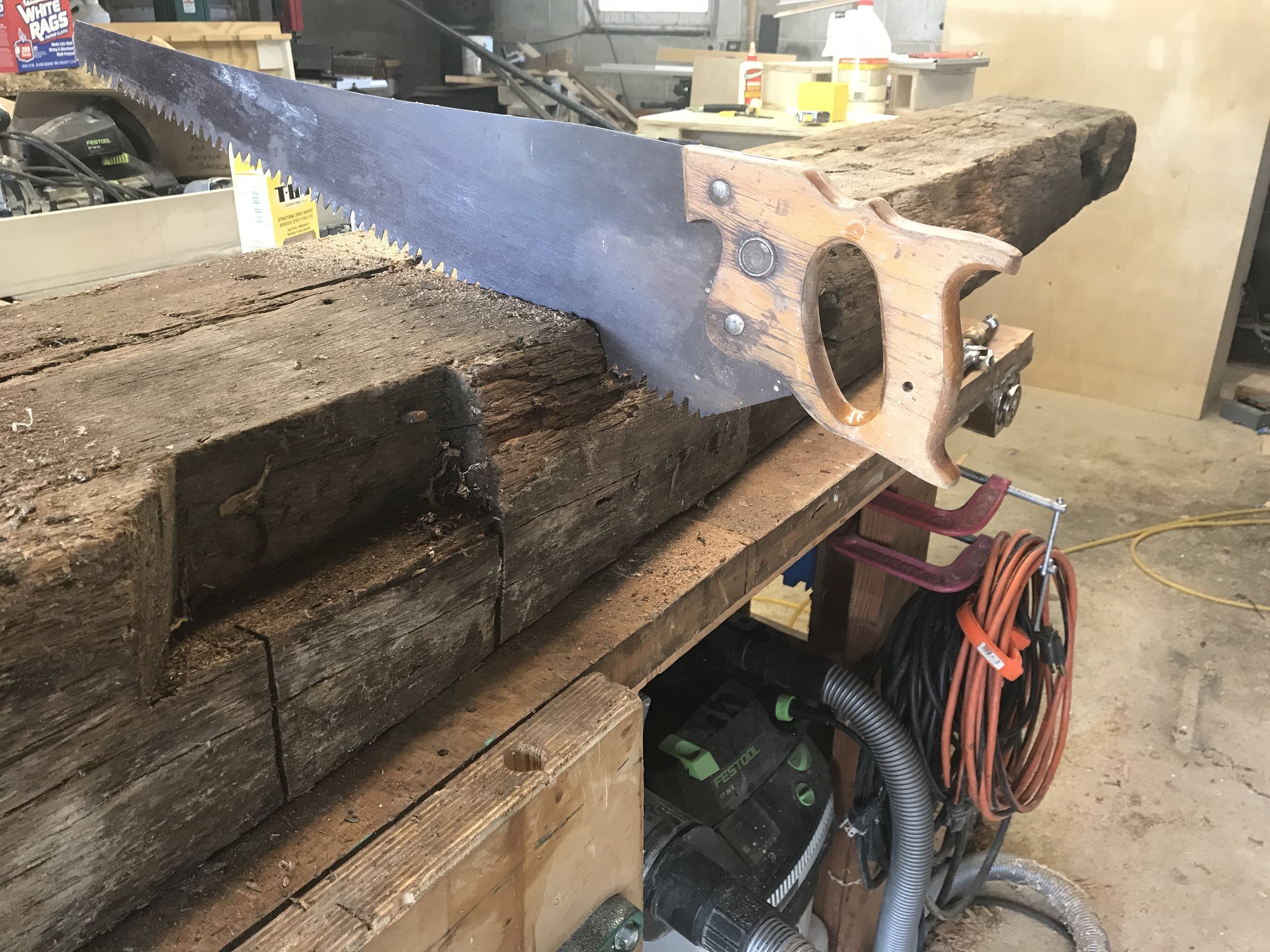  A landscape design firm I work with on various projects came to me with a client who wanted a mantle for their new outdoor fireplace. We decided upon one of the 200-year-old red oak barn beams I have in stock. After doing some layout to preserve the