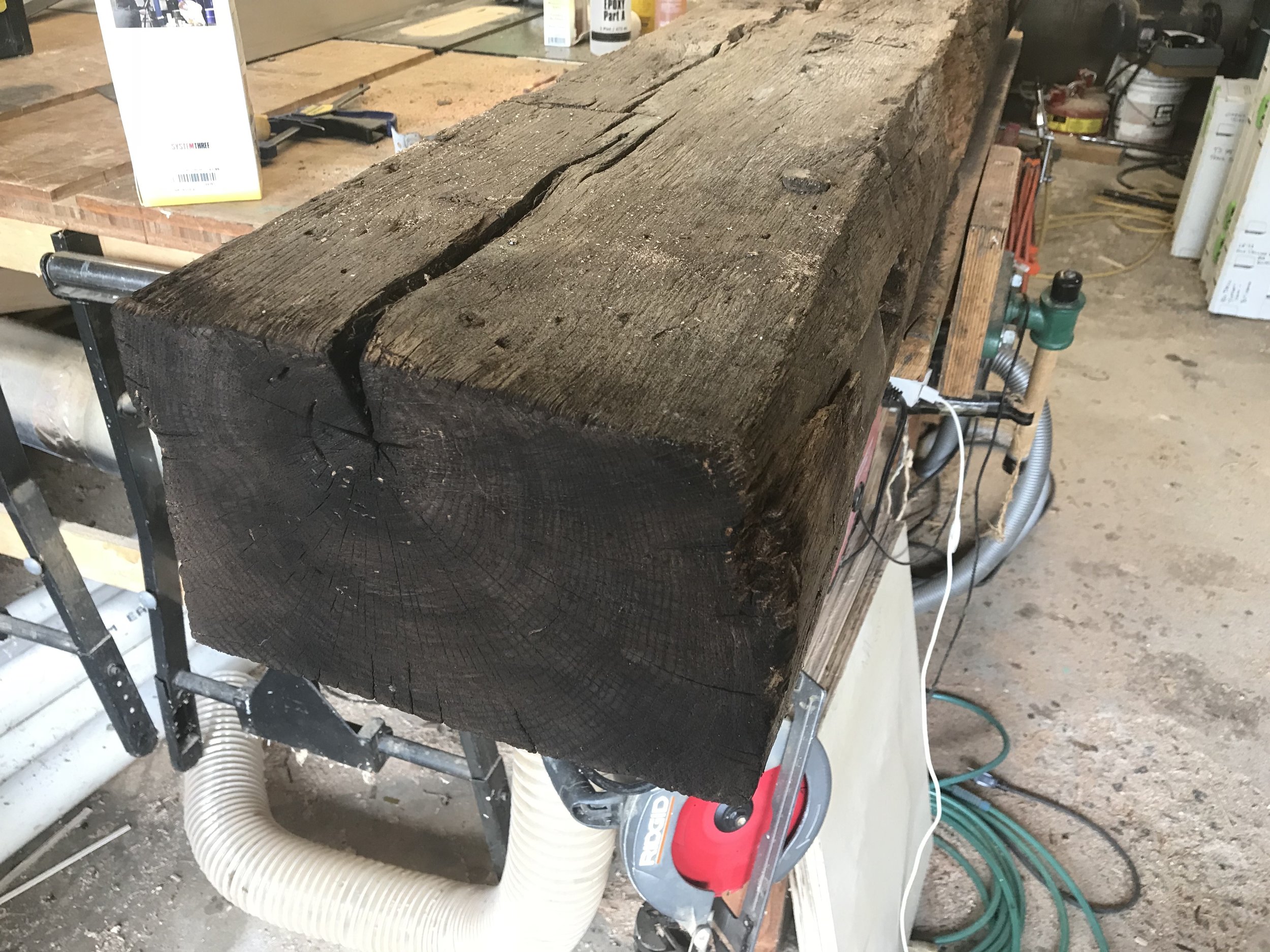  The freshly antiqued cut end of the beam. After the finish is applied, the end blends in seamlessly with the rest of the beam.  