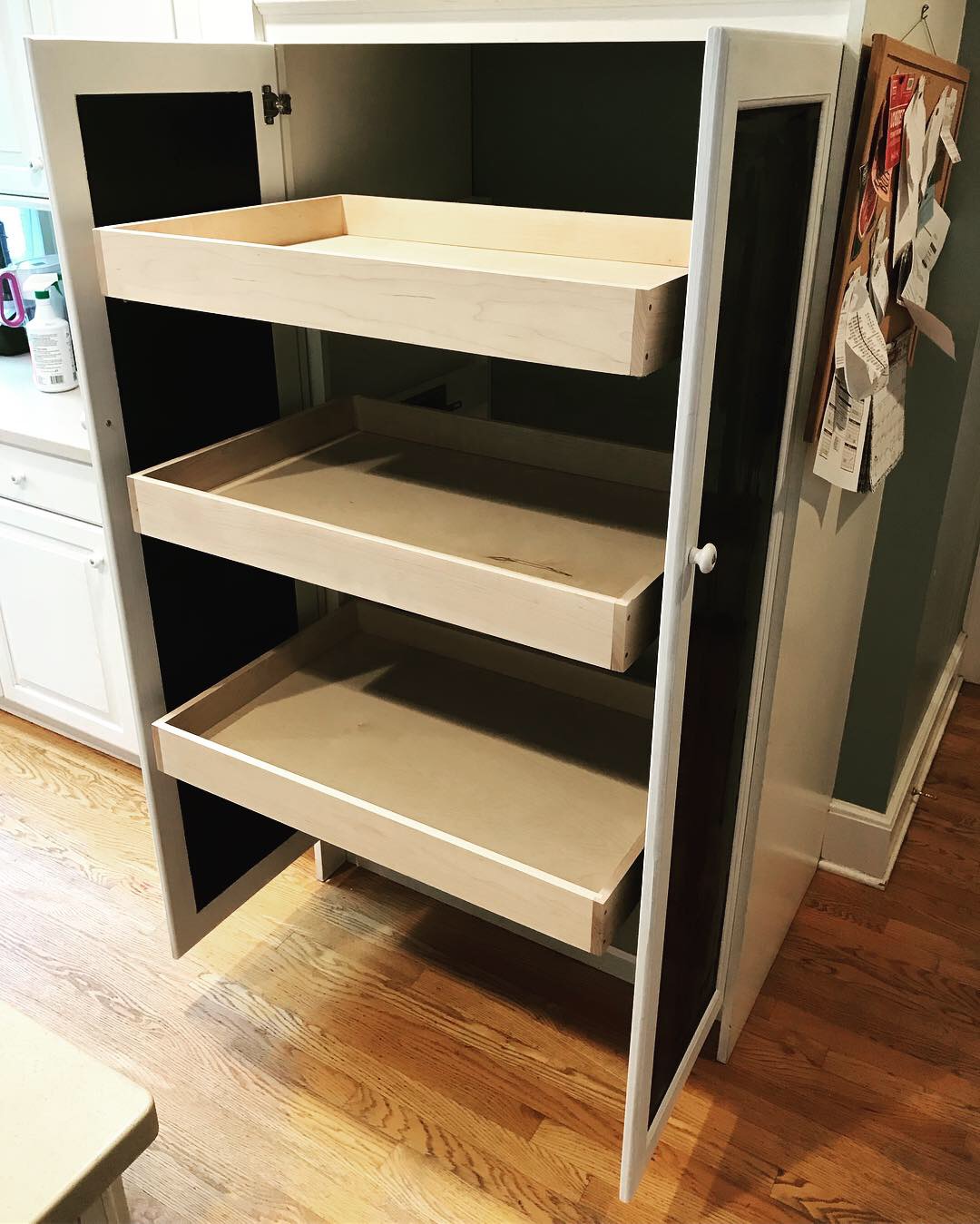  A shot of the cabinet fully opened and drawers extended. 