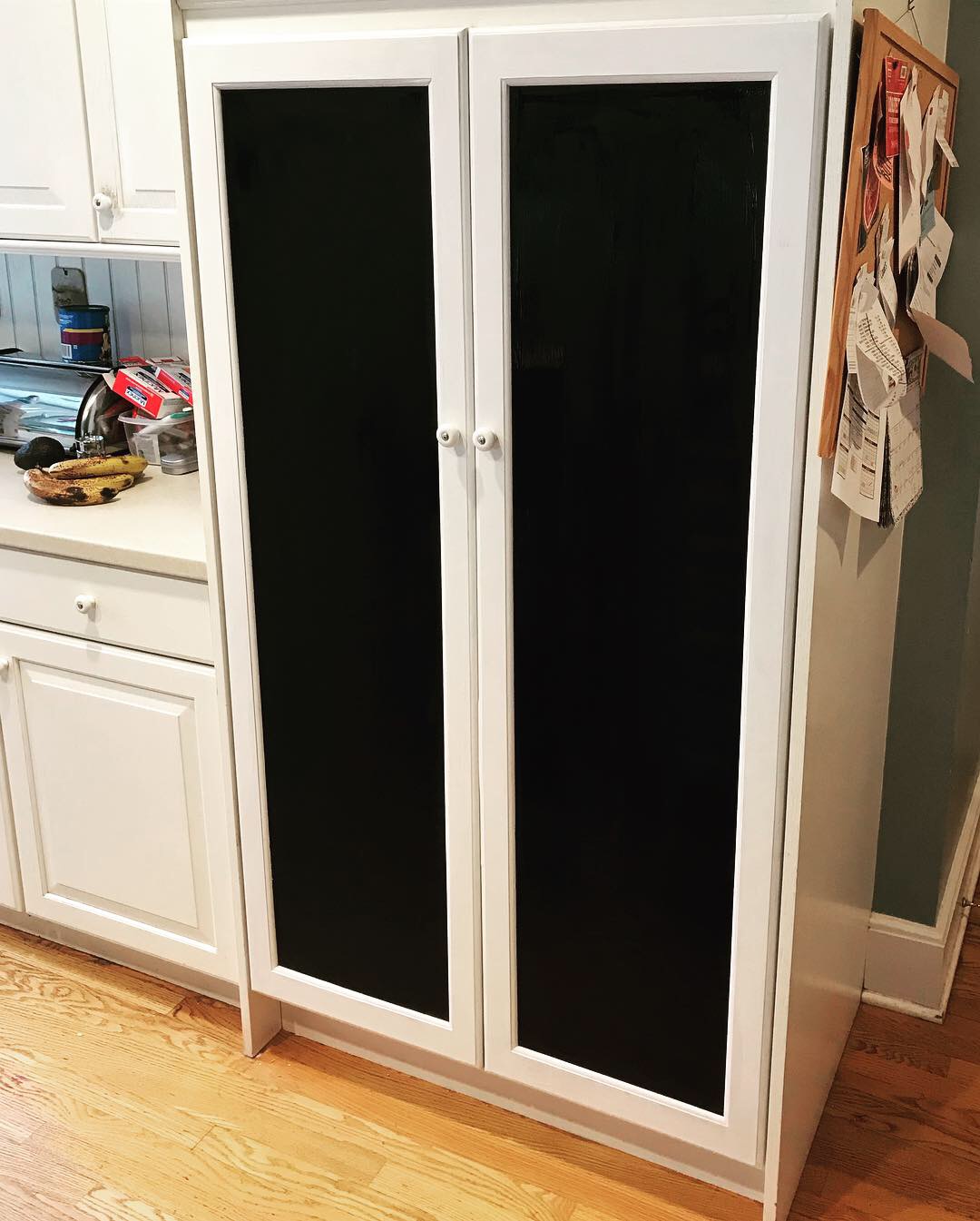  The doors are made of solid red oak to match the other cabinets in the kitchen The center panels are painted with chalkboard paint on both sides and provide plenty of space for notes, grocery lists, etc.  