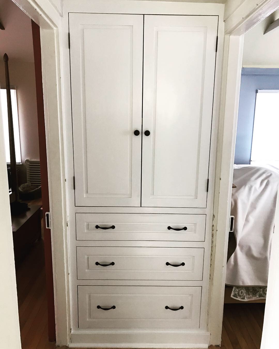  The finished linen closet. The doors and drawer fronts all have a squared off raised panel design to match the doors on either side leading to the bedrooms.  