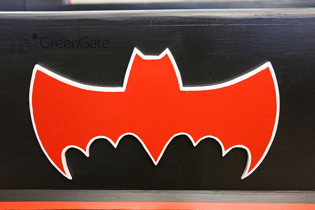  A closeup of the Bat logo on the side rail of the bed. 