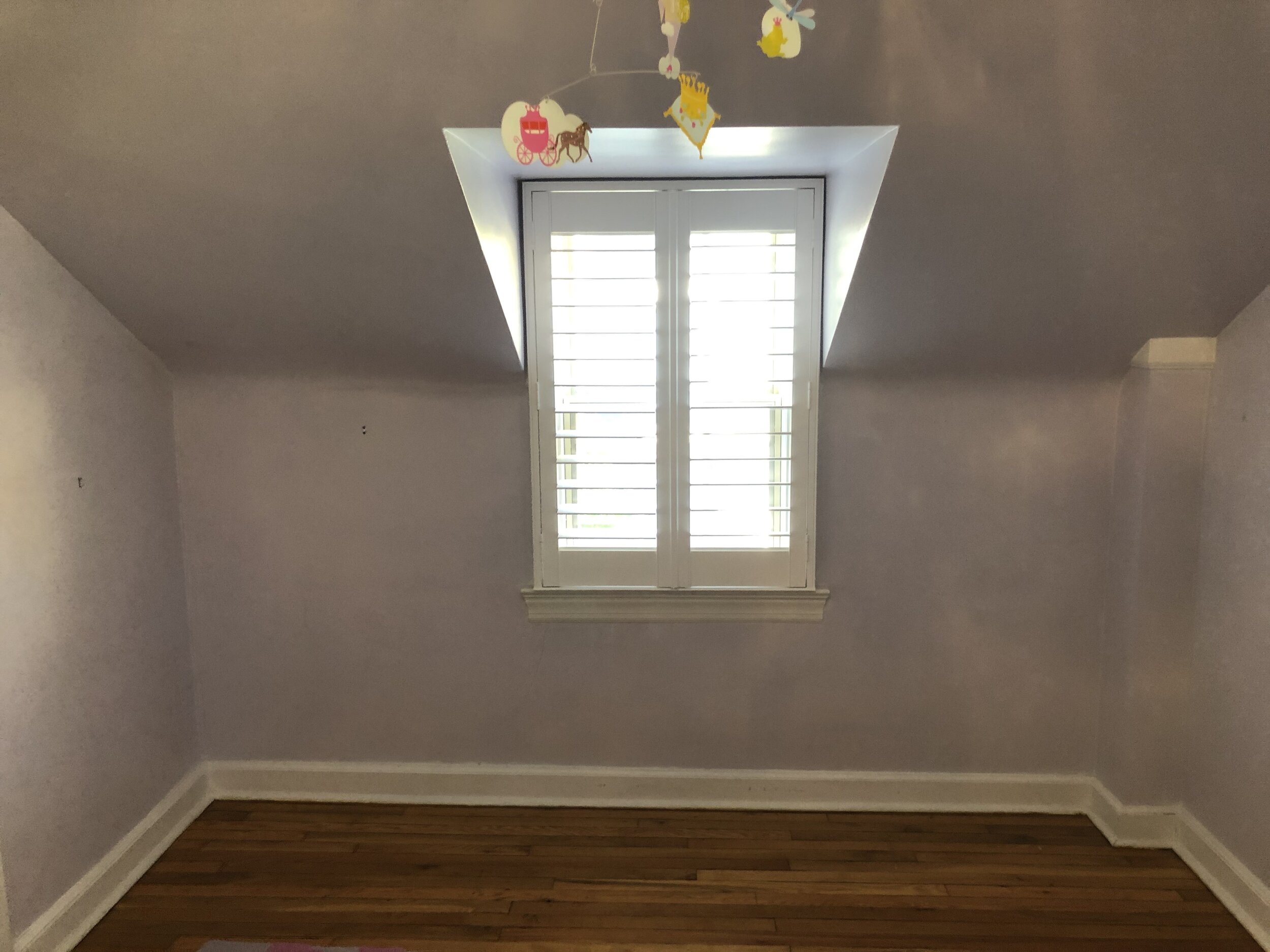  A client contacted me to create a built-in window seat and a pair of storage cabinets for this unique space in their daughter’s room. This was the space before I started. 
