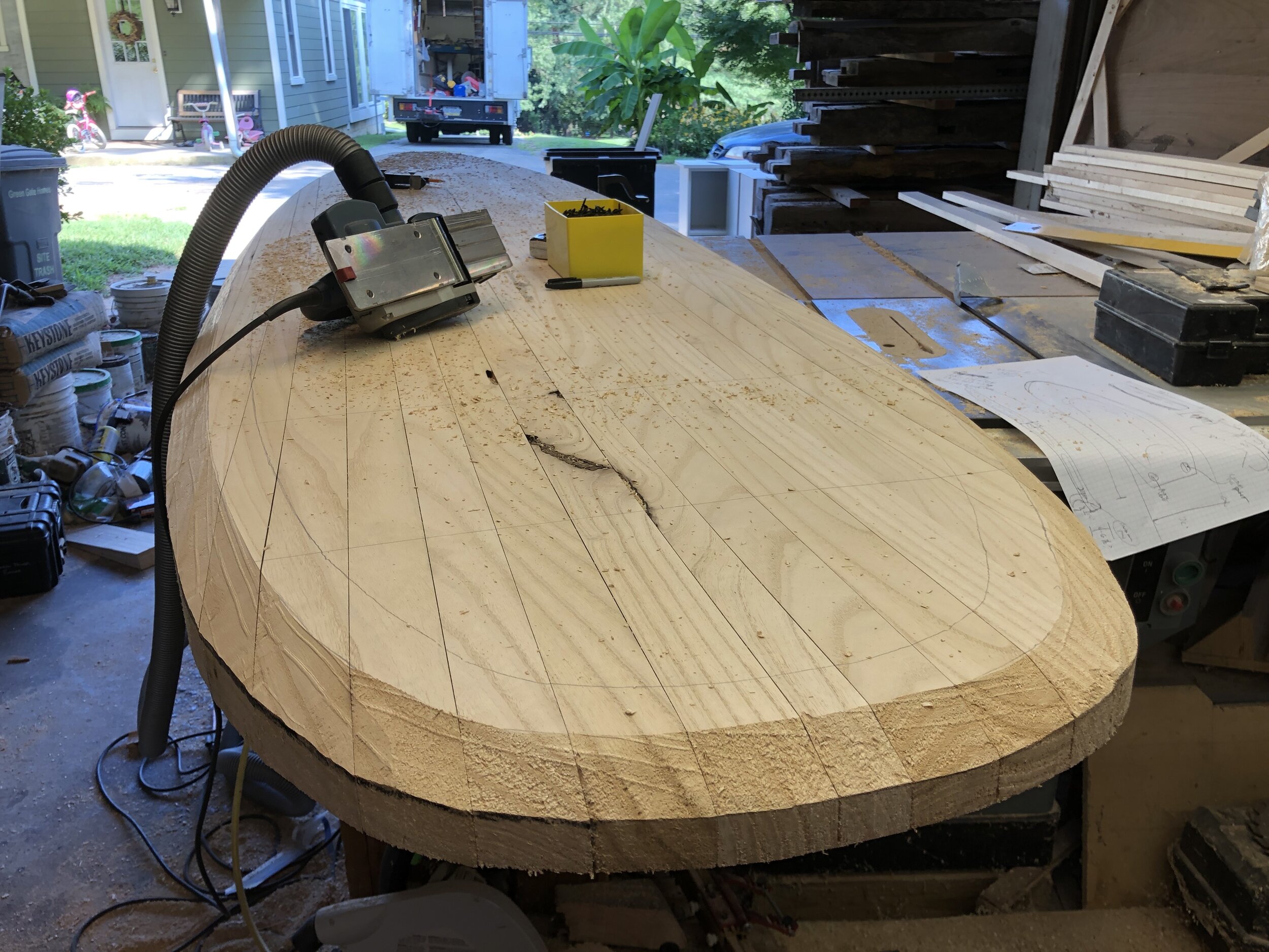  The next step was to shape the rails of the board using a power planer. 